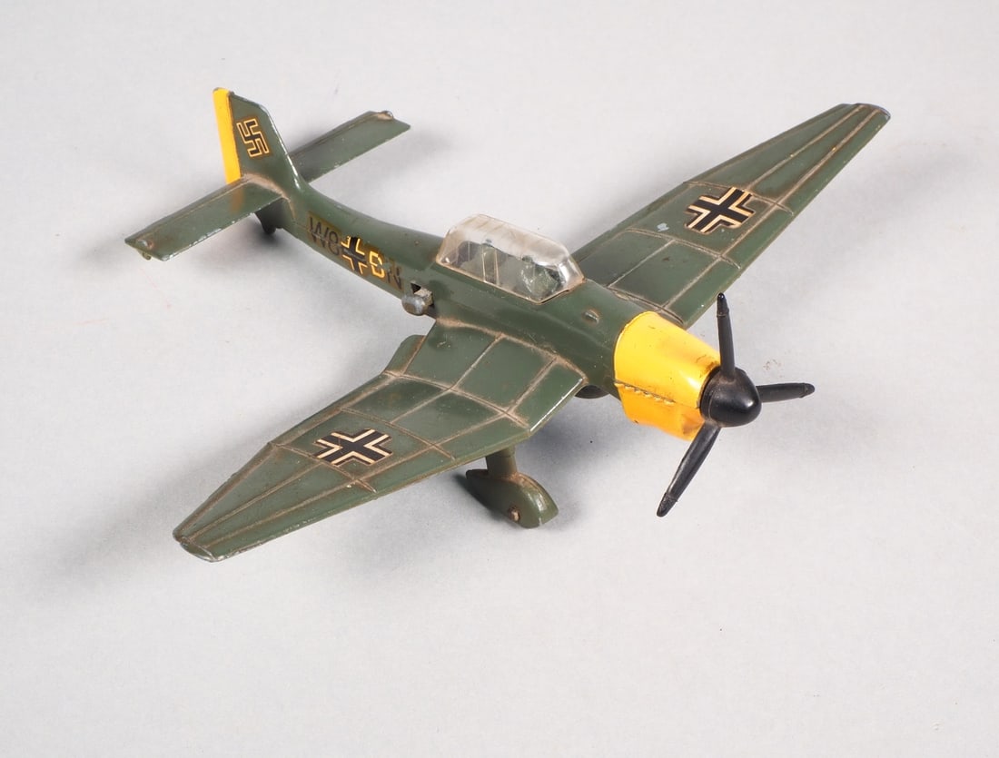 Stuka metal toy with dropping bomb: Stuka metal toy with dropping bombMetal model of the Junkers Ju 87 B, dive bomber. Very nice condition, bomb can be released, approx. 15 cm long and 19 cm wide. From Dinky Toys 1960s -1970sStuka Metal