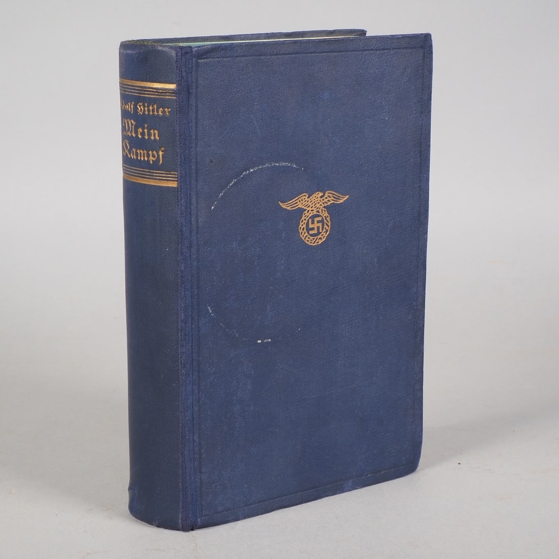 MEIN KAMPF, by Adolf Hitler, 1934: MEIN KAMPF, by Adolf Hitler, 1934781 p., portrait of the Führer, dark blue full cloth binding, gold embossed spine in Fraktur script, gold party eagle with swastika in oak wreath embossed on front co