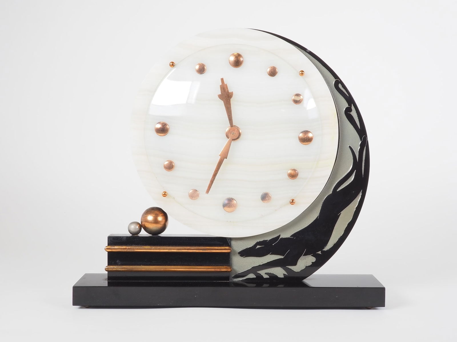 Art Deco clock, France around 1920: Art Deco clock, France around 1920Black granite base and holder with fox relief. The clock is made of white marble with copper-colored hands and button indices under glass. On the back winding and han