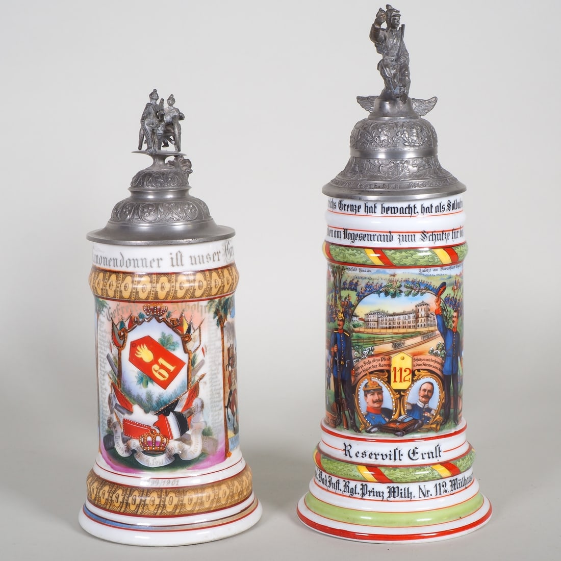 German Empire: Two reservist mugs, Mülhausen and Darmstadt: German Empire: Two reservist mugs, Mülhausen and DarmstadtPair of porcelain reservist mugs with painting. 1) 9th Comp. 4th Baden Infantry Regiment “Prinz Wilhelm” No. 112 Mülhaus