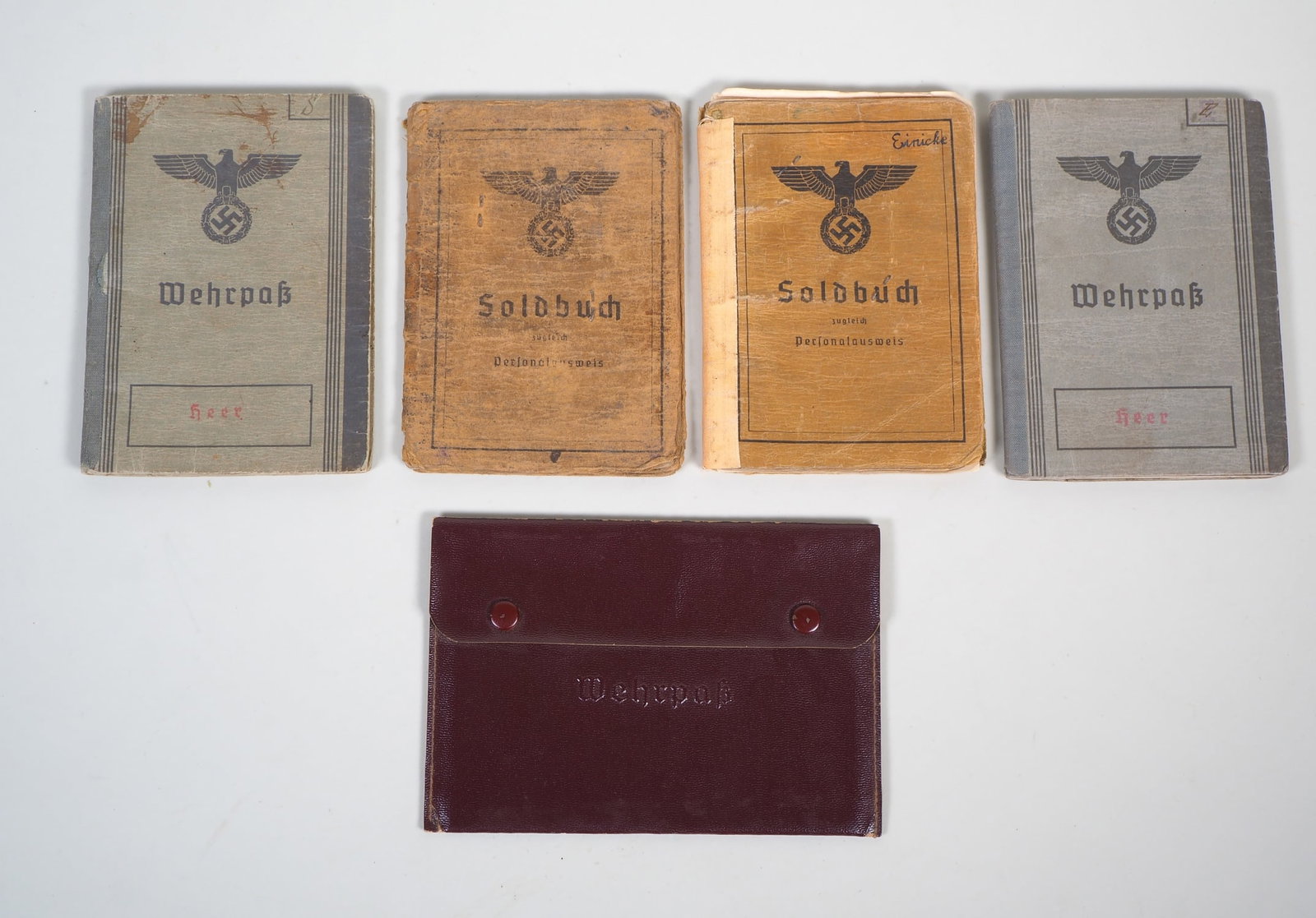 Wehrmacht Wehrpass and Soldbuch Konvolut, 4 pcs.: Wehrmacht Wehrpass and Soldbuch Konvolut, 4 pcs.1.) Wehrpaß (Ulm) with entries for WW1 with Inf.-Rgt. 120, with awards, with training as MG-Gewehrführer. 2.) Wehrpaß (Ingoldstadt). 3.) 