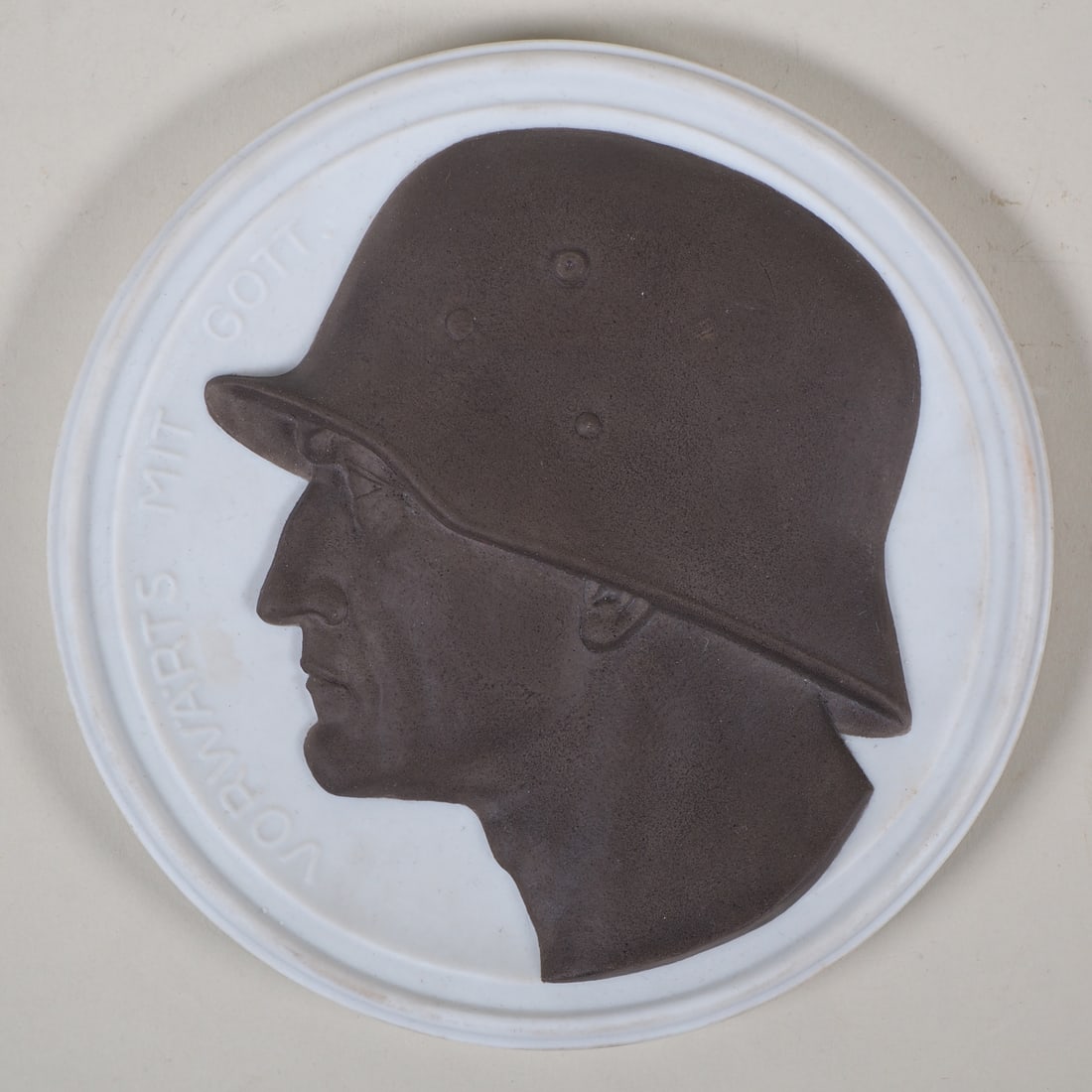 Fine porcelain wall relief, Forward with God, circa 1918: Fine porcelain wall relief, Forward with God, circa 1918 Bisque porcelain, finely molded relief portrait of a soldier wearing a steel helmet, which is colored dark gray. To the left is the raised lett