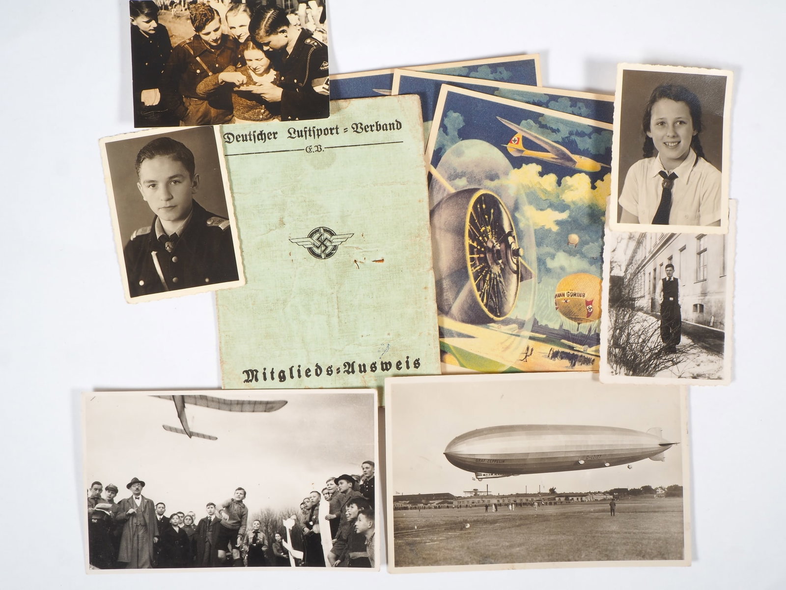 DLV NSDAP collection HJ Third Reich: DLV NSDAP collection HJ Third Reich Consisting of: German Air Sports Association membership card Munich Freimann Neuaubing from 1935. 3 NSFK postcards with image of “Hermann Göring” balloon. 