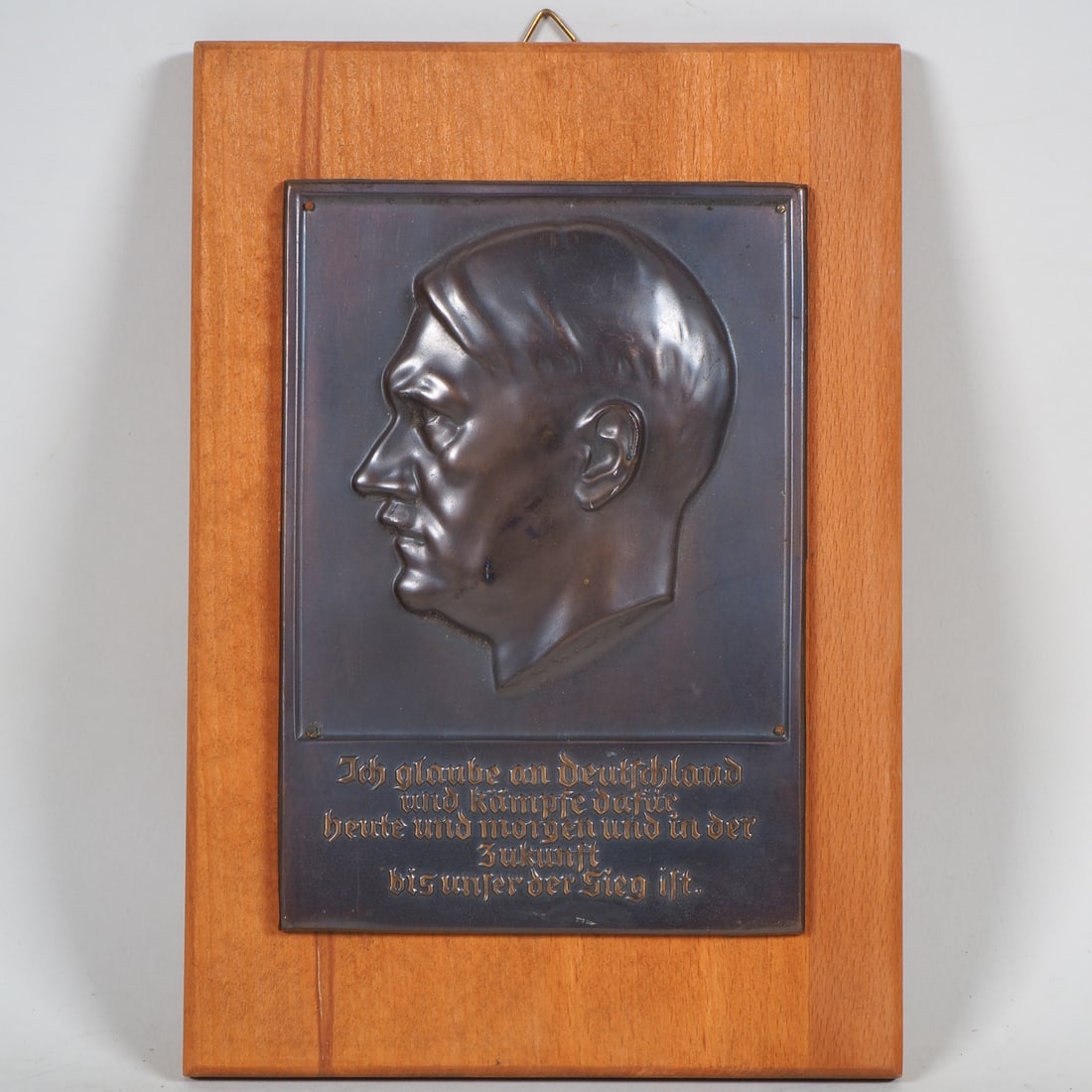 Bronze wall plaque Adolf Hitler, W. Wolff 1933: Bronze wall plaque Adolf Hitler, W. Wolff 1933 Bronze wall relief, side portrait of Adolf Hitler, nailed to a modern wooden board, artist's signature "W. Wolff 33" on the neck. Underneath slightly col