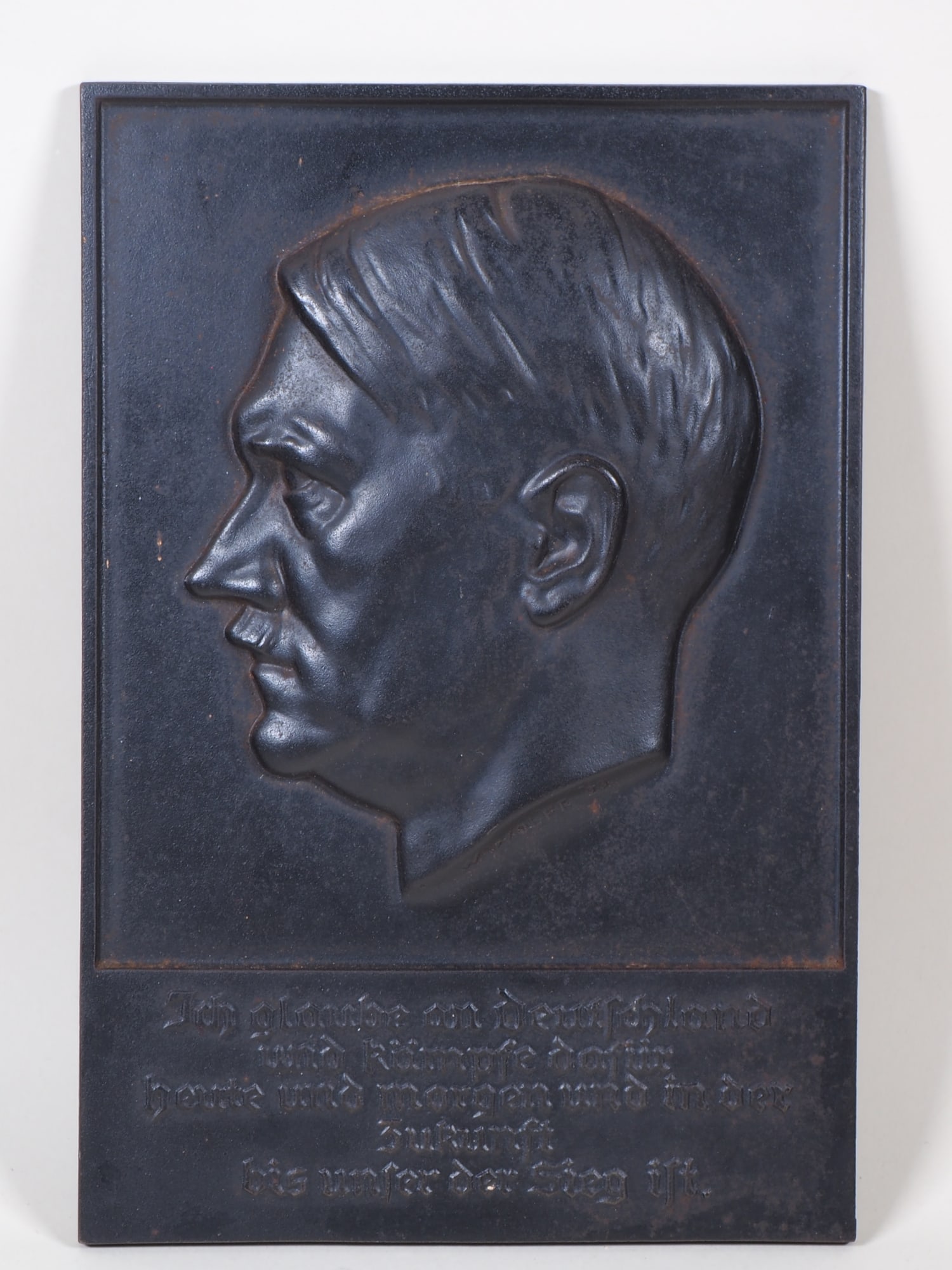Large iron wall relief of Adolf Hitler, W. Wolff 1933: Large iron wall relief of Adolf Hitler, W. Wolff 1933 Cast iron wall relief with black patina, side portrait of Adolf Hitler, artist's signature “W. Wolff 33” on the neck. Below, raised letter