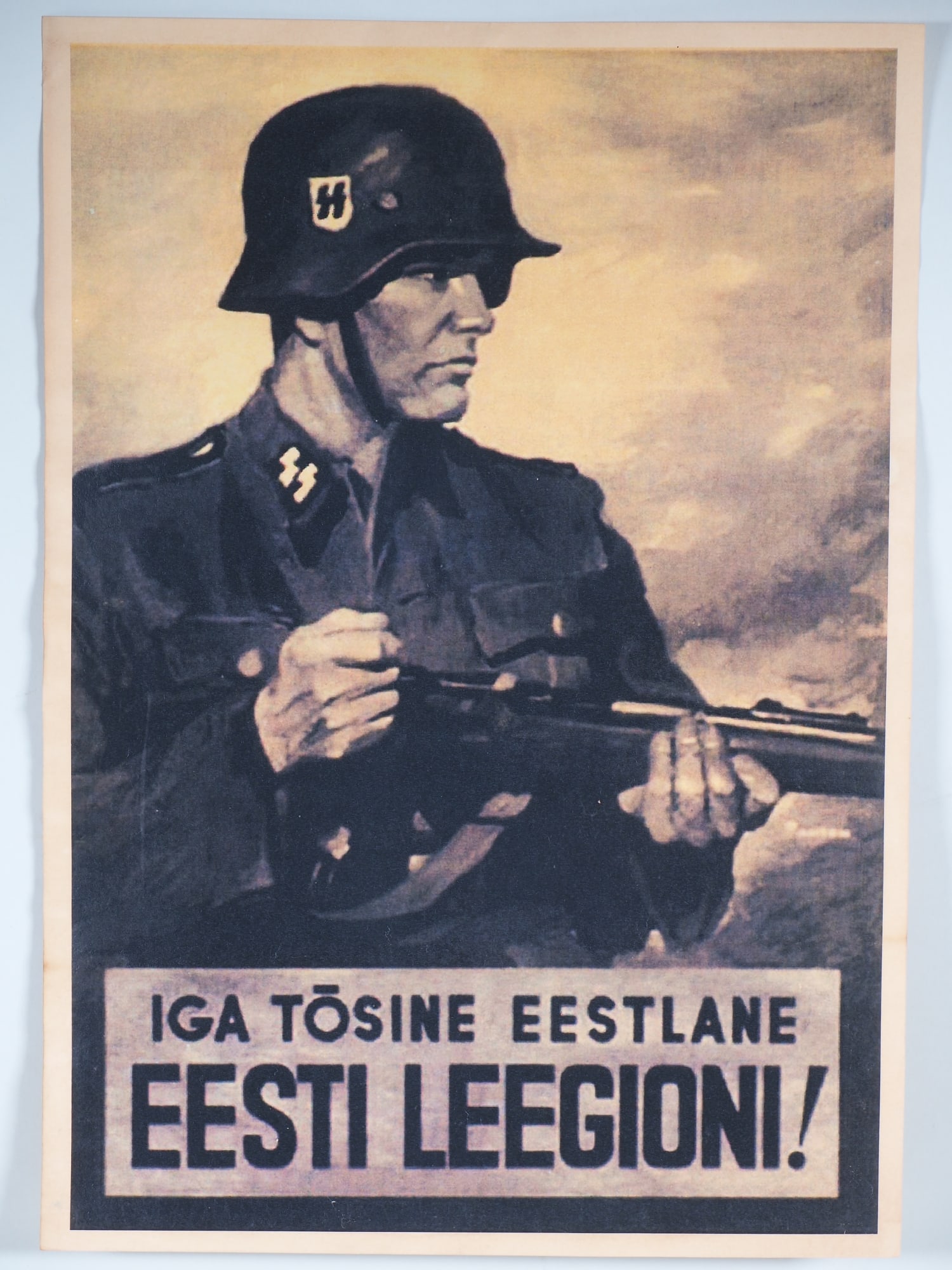 Estonian SS Division recruitment poster, propaganda poster: Estonian SS Division recruitment poster, propaganda poster Lithograph war poster for recruitment to the Estonian SS Division, depicting an SS soldier with a carbine, inscribed “IGA TOSINE EESTLANE E