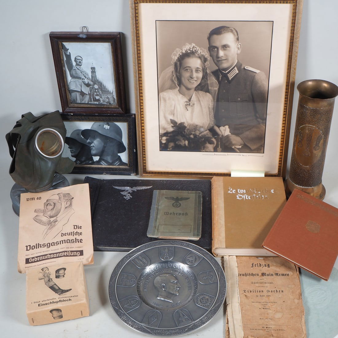 Third Reich collection, WH photo album, military pass, etc.: Third Reich collection, WH photo album, military pass, etc. Collection consisting of a large wedding portrait of a Wehrmacht officer holding a dagger. Luftwaffe WH photo album with views of Bordeaux,