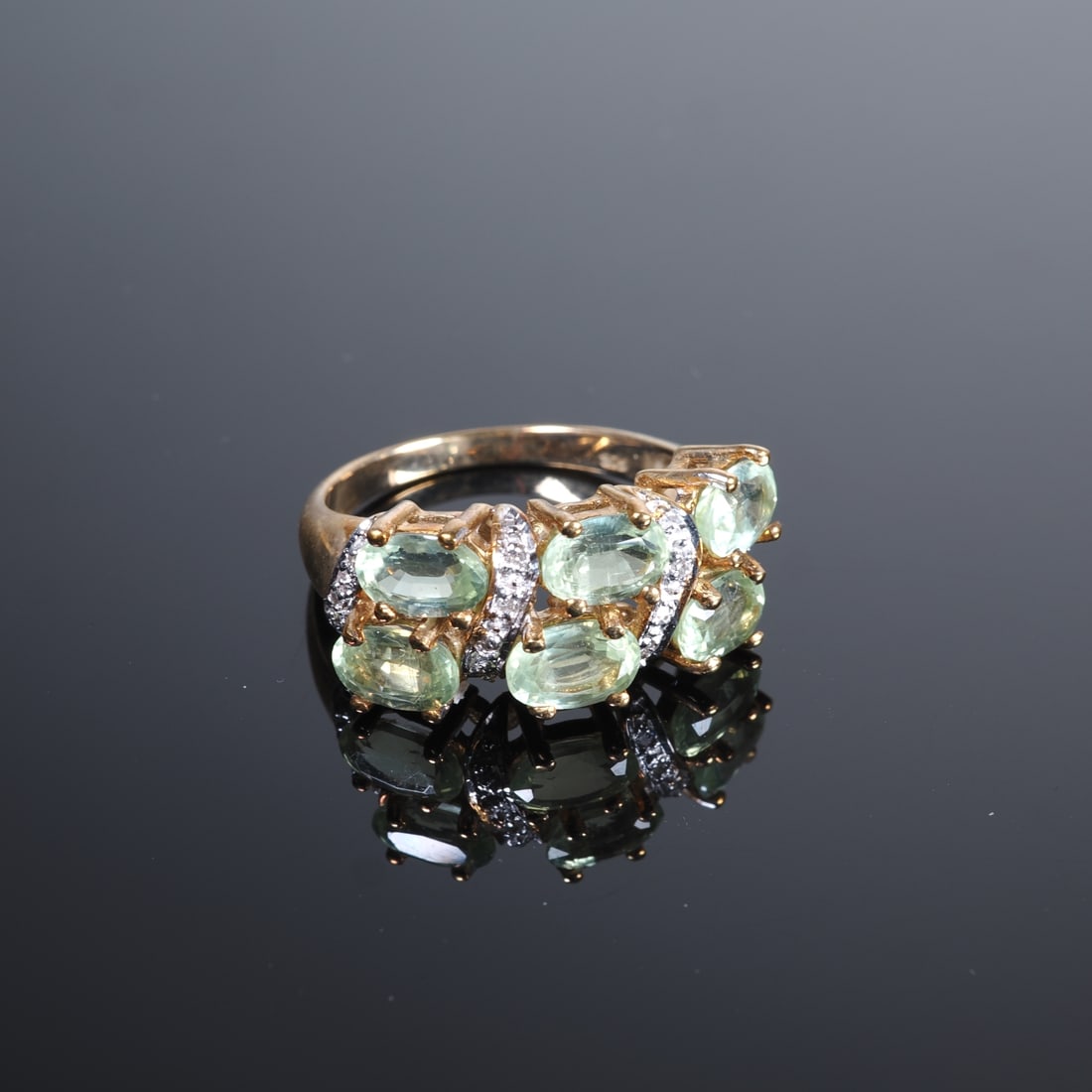 Mint Kyanite Gold Ring: Mint Kyanite Gold Ring9ct yellow gold, ring head set with 6 oval faceted mint kyanites from Afghanistan, approx. 3.66ct, ring shanks set with 14 round-cut diamonds, total approx. 0.057ct, virtually ne