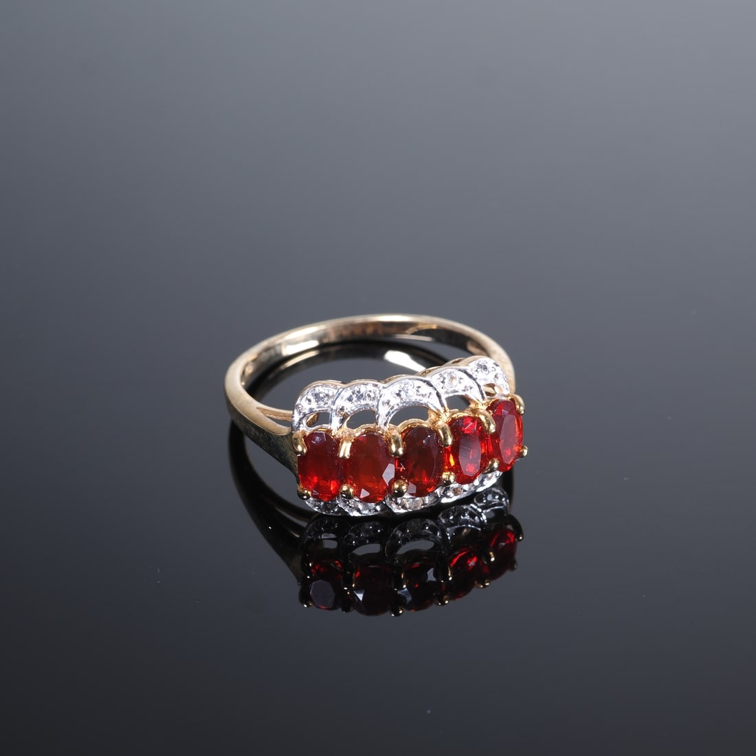 Querétaro Fire Opal Gold Ring: Querétaro Fire Opal Gold Ring9ct yellow gold, 375/000 fineness, ring head set with 5 Queretaro fire opals from Mexico, approx. 0.68ct, and sides set with cubic zirconia, virtually new and unworn,