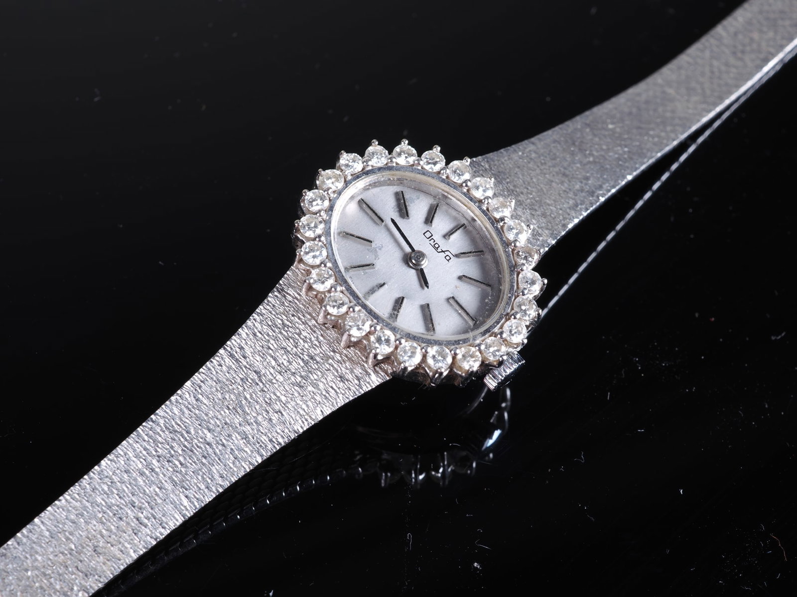 Orafa ladies’ wristwatch with a 1.0ct diamond bezel: Orafa ladies’ wristwatch with a 1.0ct diamond bezelin a 14K white gold case and 14K white gold strap. 23 set diamonds, total 1.0ct (according to certificate). Total weight 35.4g. Comes with certific