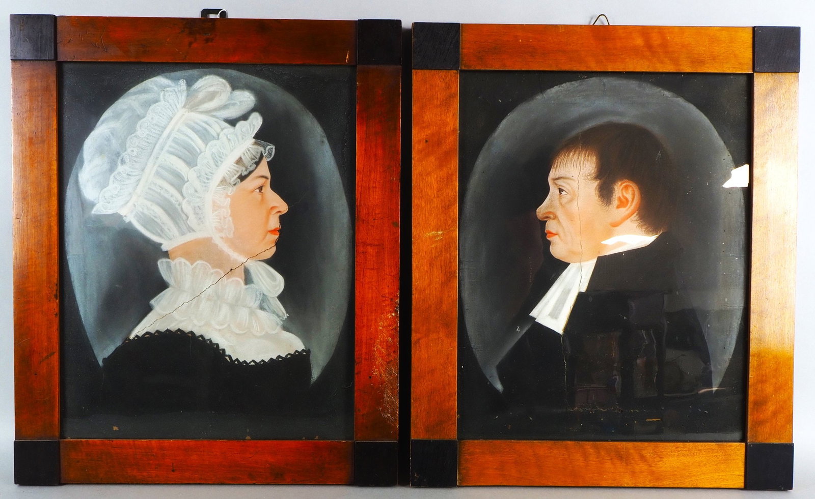Classicism wedding pictures of a couple, 1803.: Classicism wedding pictures of a couple, 1803.Gouache on paper on wood, framed in a Biedermeier wooden frame behind glass. A gentleman and lady in profile: a pastor in black robe with white collar and