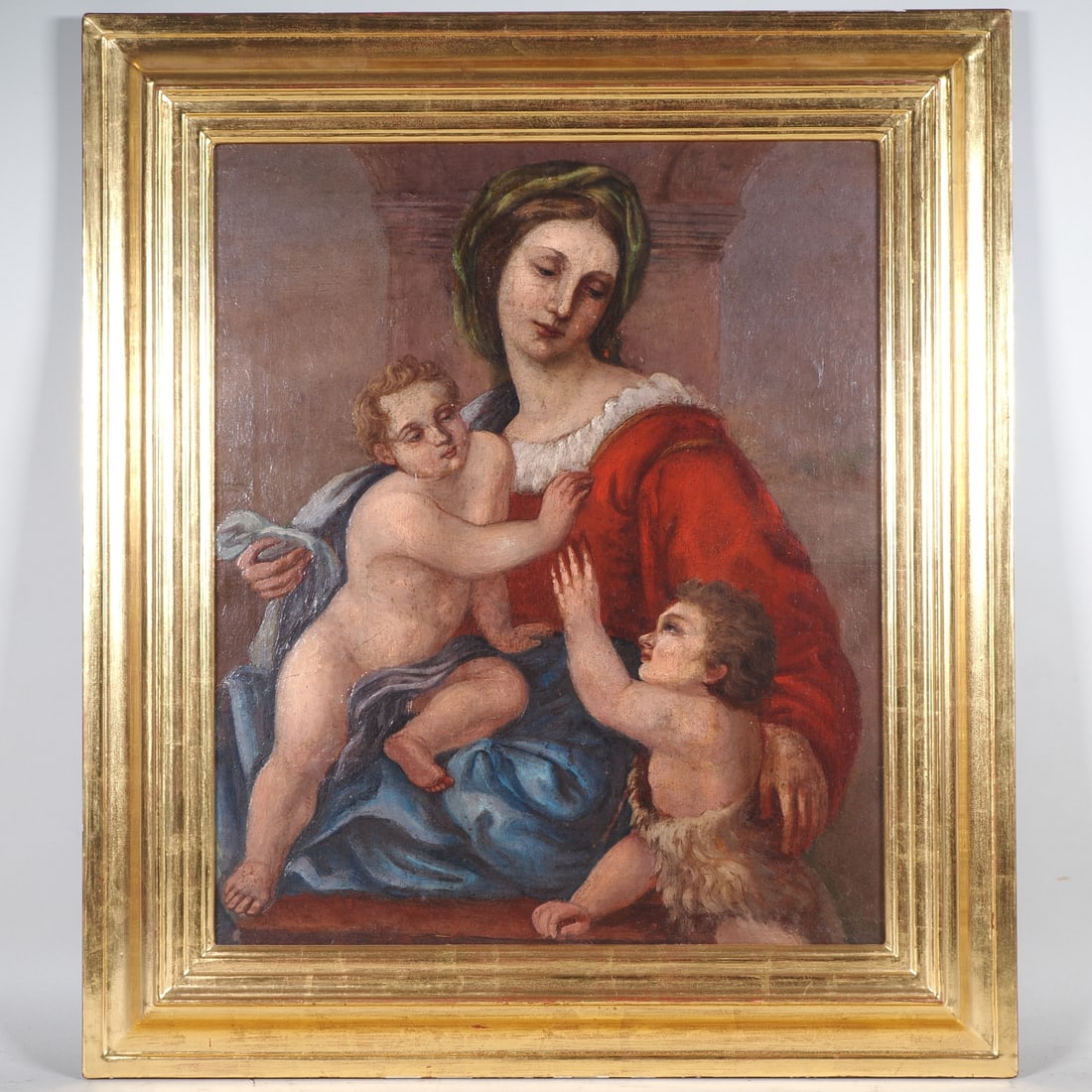 Madonna and Child with the Young St John: Madonna and Child with the Young St JohnOil on canvas, mounted on a wooden panel in modern times and framed in a gilded moulding. Depiction of the Virgin Mary in a bright red robe and blue cloak, hold