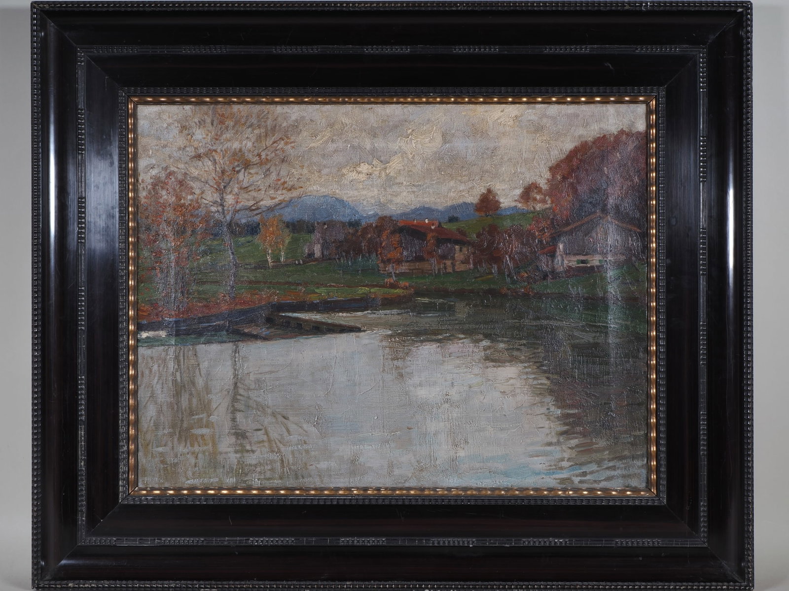Autumnal river landscape with farmstead, circa 1900: Autumnal river landscape with farmstead, circa 1900Oil on canvas. Atmospheric landscape with a calm river in the foreground, its waters reflecting the autumnal colours of the trees and the overcast sk