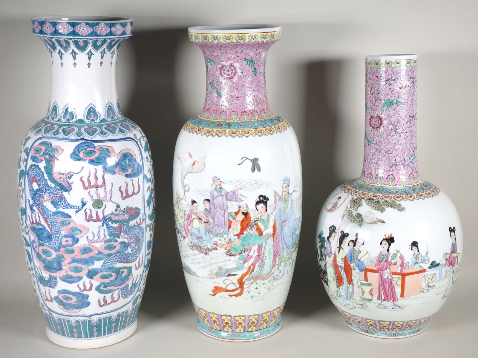 3 large baluster vases, Famille Rose, China, 20th century: 3 large baluster vases, Famille Rose, China, 20th century3 large porcelain vases from China, 2 of which bear a red base mark and are decorated with Famille Rose glaze colours, and one vase with blue a
