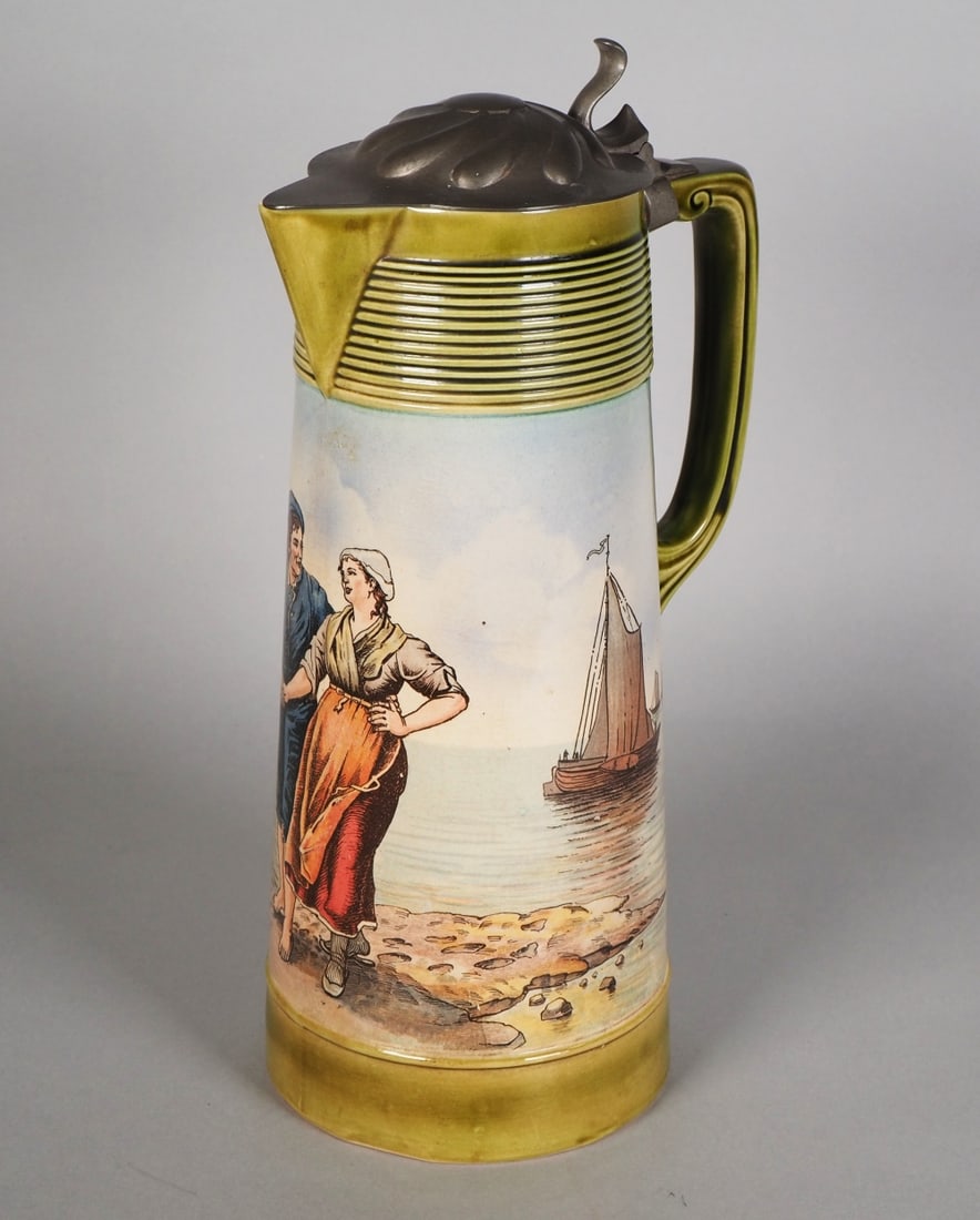 Villeroy & Boch, large art nouveau jug, around 1900.: Villeroy & Boch, large art nouveau jug, around 1900.Made of glazed ceramic, polychrome painted, with pewter lid. Very detailed depiction of a couple at a stand with a windmill and sailing ships. Stamp