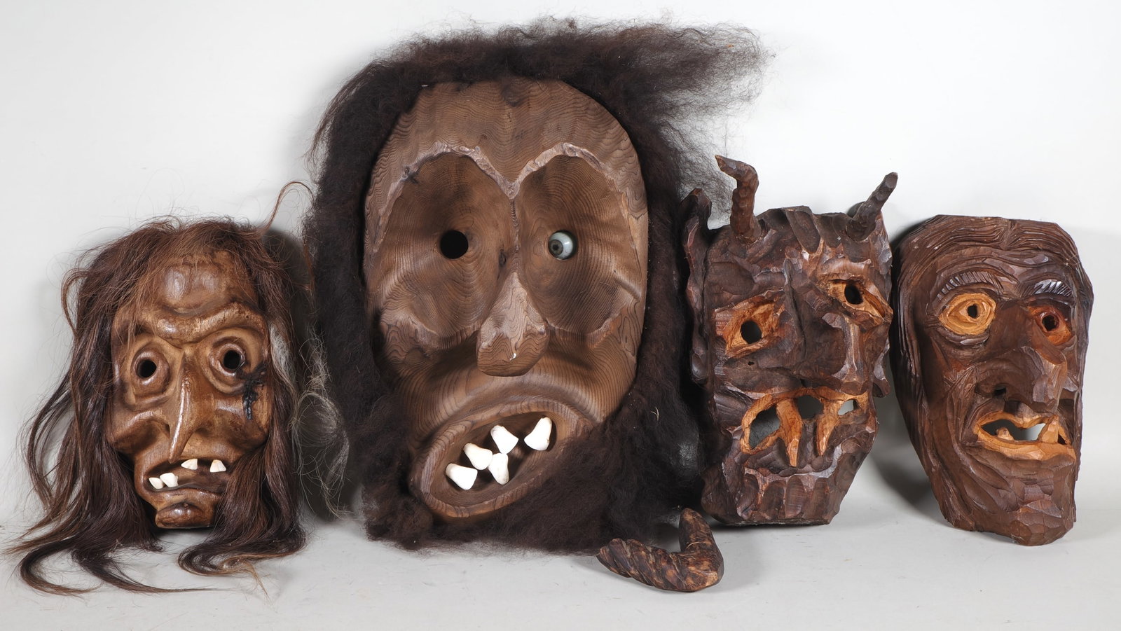 Collection of Swabian-Alemannic carnival masks, carved from wood: Collection of Swabian-Alemannic carnival masks, carved from woodFour high-quality, hand-carved carnival masks, known as Schemen, decorated with real hair and animal teeth. In typical traditional witch