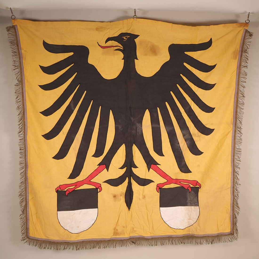 Rare flag of the free Imperial City of Ulm, 1930s: Rare flag of the free Imperial City of Ulm, 1930sA city flag made of yellow cloth, featuring a sewn-on black eagle of the Holy Roman Empire, with the black-and-white coat of arms of Ulm in each of its