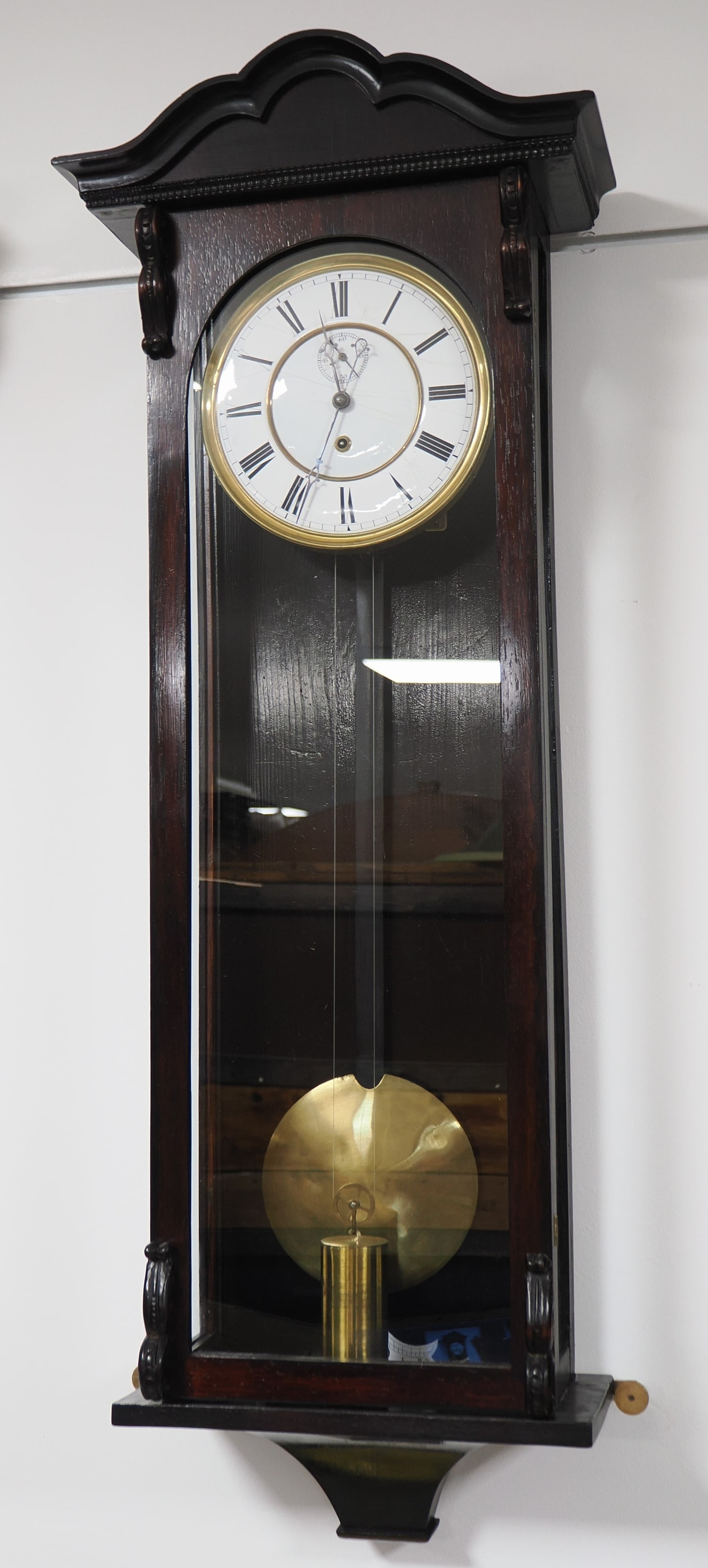 North German regulator, circa 1850: North German regulator, circa 1850Case made of veneered mahogany, rectangular in shape, with glass on three sides at the front and a door; acanthus-style ornamentation at the corners; slide-type