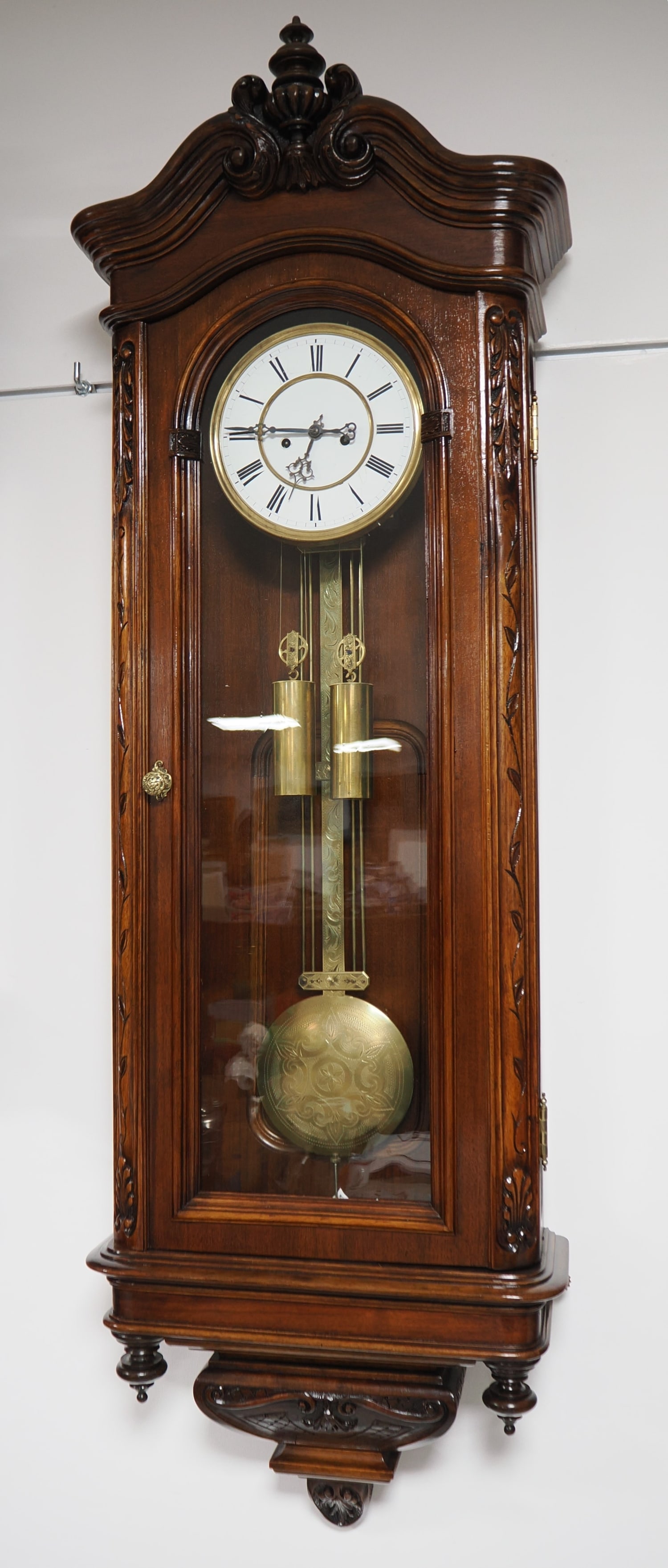 Large Viennese ornate regulator, circa 1880: Large Viennese ornate regulator, circa 1880Large wooden case with walnut veneer, solid wood trim, beautifully and lavishly decorated with carvings and turned woodwork, glazed on three sides, with a do