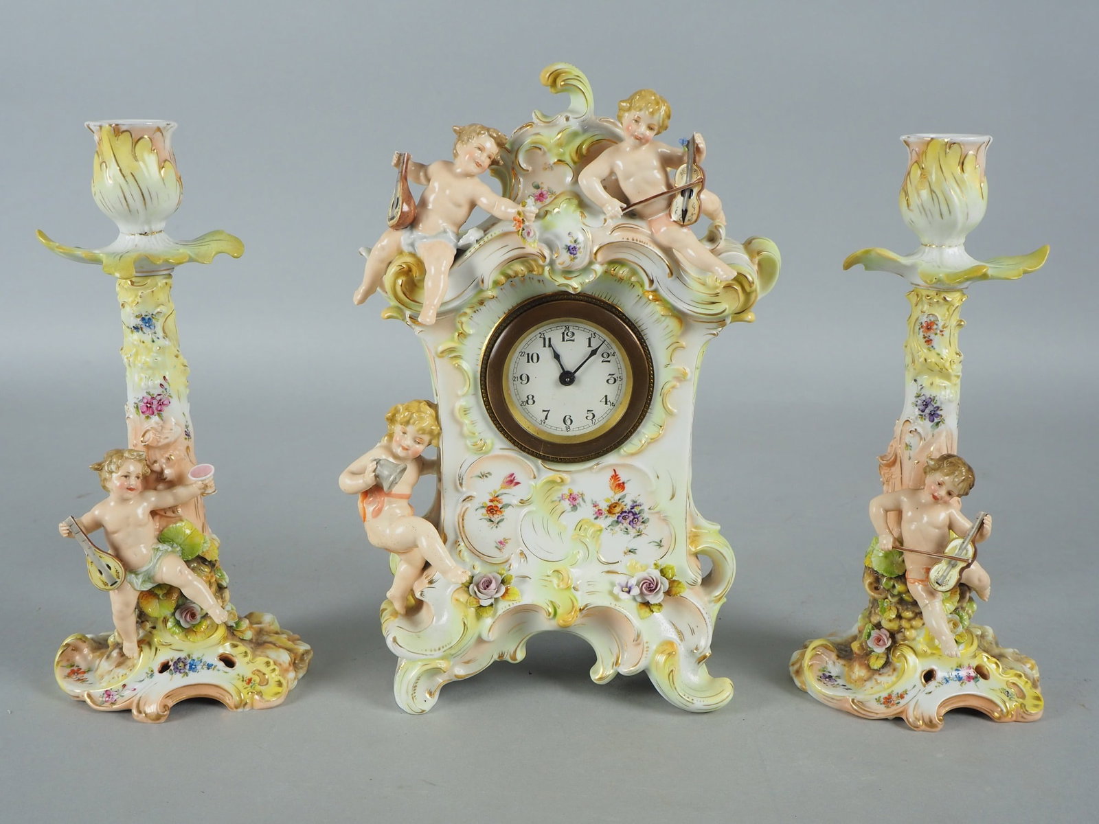Porcelain clocks ensemble, around 1900 (1 of 8)