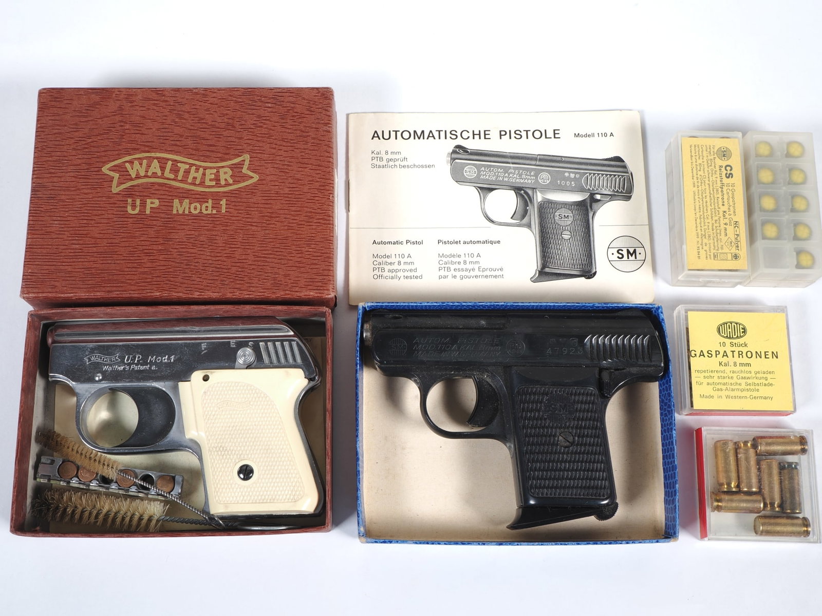 Walther U.P. Mod. 1 and SM Mod. 110 A alarm pistols, 1950s/60s: Walther U.P. Mod. 1 and SM Mod. 110 A alarm pistols, 1950s/60sWalther Universal Pistol U.P. Mod. 1 in 6 mm Flobert calibre, solid construction, chrome-plated metal housing with white plastic grip pane