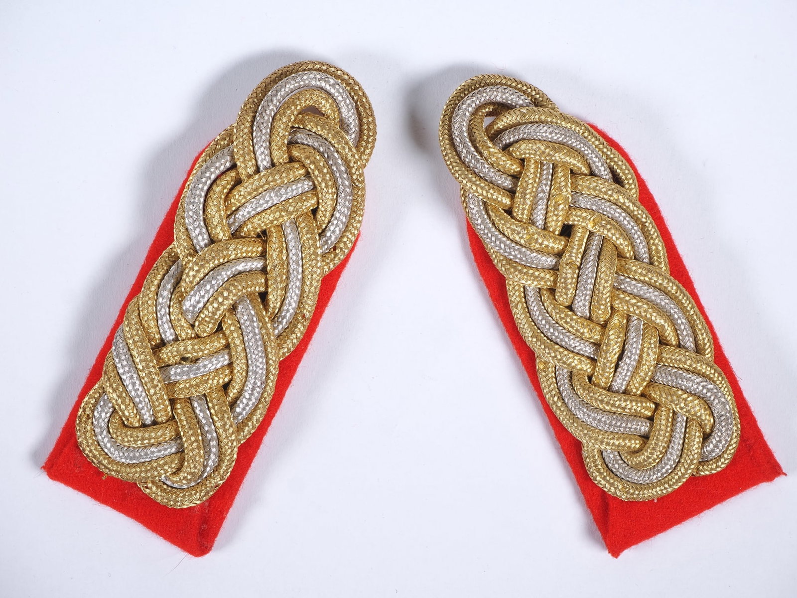 Pair of Wehrmacht Major General shoulder boards, WWII: Pair of Wehrmacht Major General shoulder boards, WWIIA pair of original Wehrmacht shoulder boards from WWII, featuring gold and silver threadwork on a red background, in very fine condition, intended
