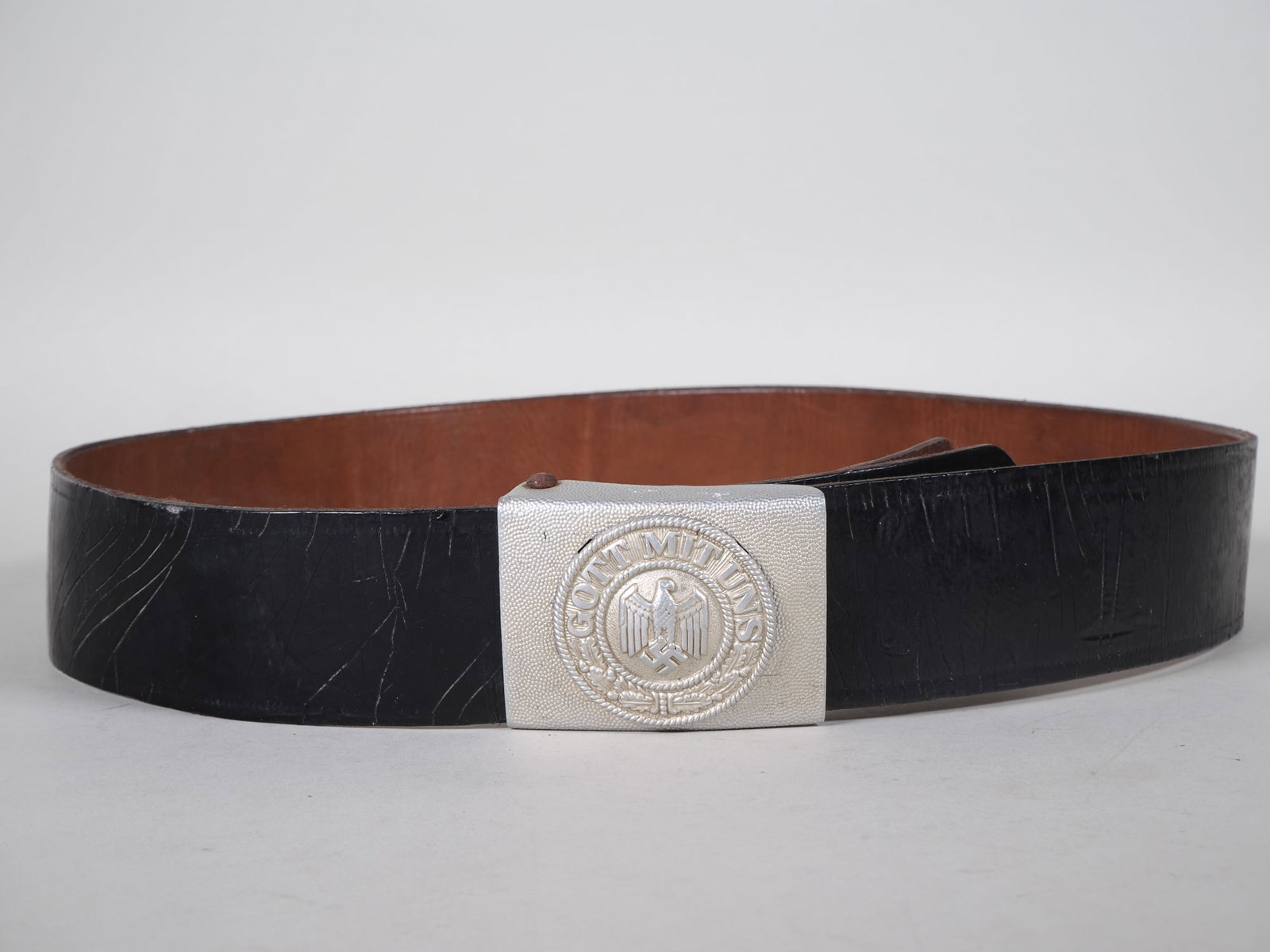 Wehrmacht parade belt buckle with patent leather strap: Wehrmacht parade belt buckle with patent leather strapAluminium belt buckle with riveted imperial eagle (two rivets missing, but holds well) and intact swastika and motto "GOTT MIT UNS" (God with us),