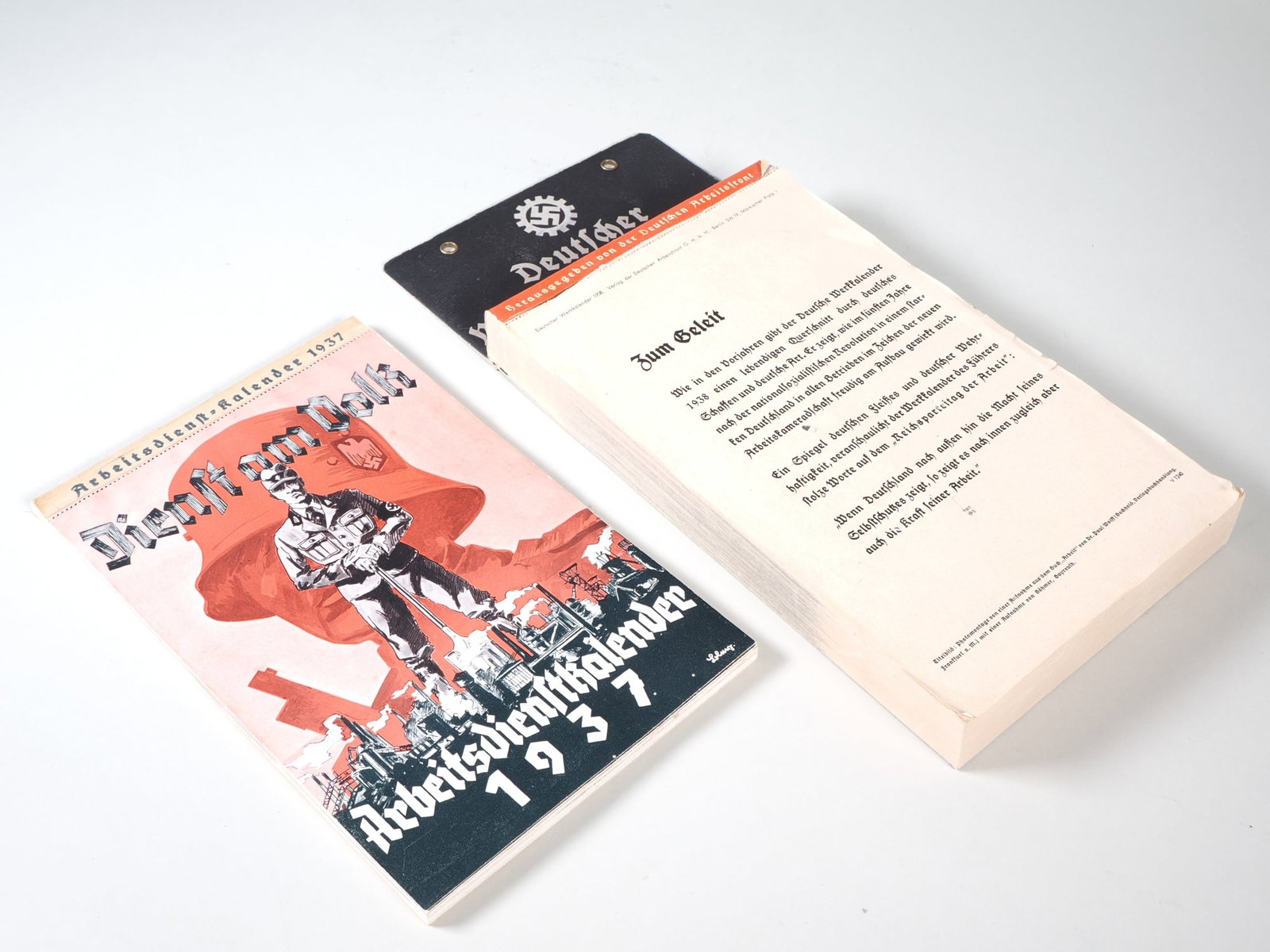 Pair of illustrated tear-off calendars from the Third Reich, 1937/38, RAD - DAF: Pair of illustrated tear-off calendars from the Third Reich, 1937/38, RAD - DAF1937 RAD work service calendar, mint condition, completely intact. German work calendar 1938 of the DAF, foreword loose,