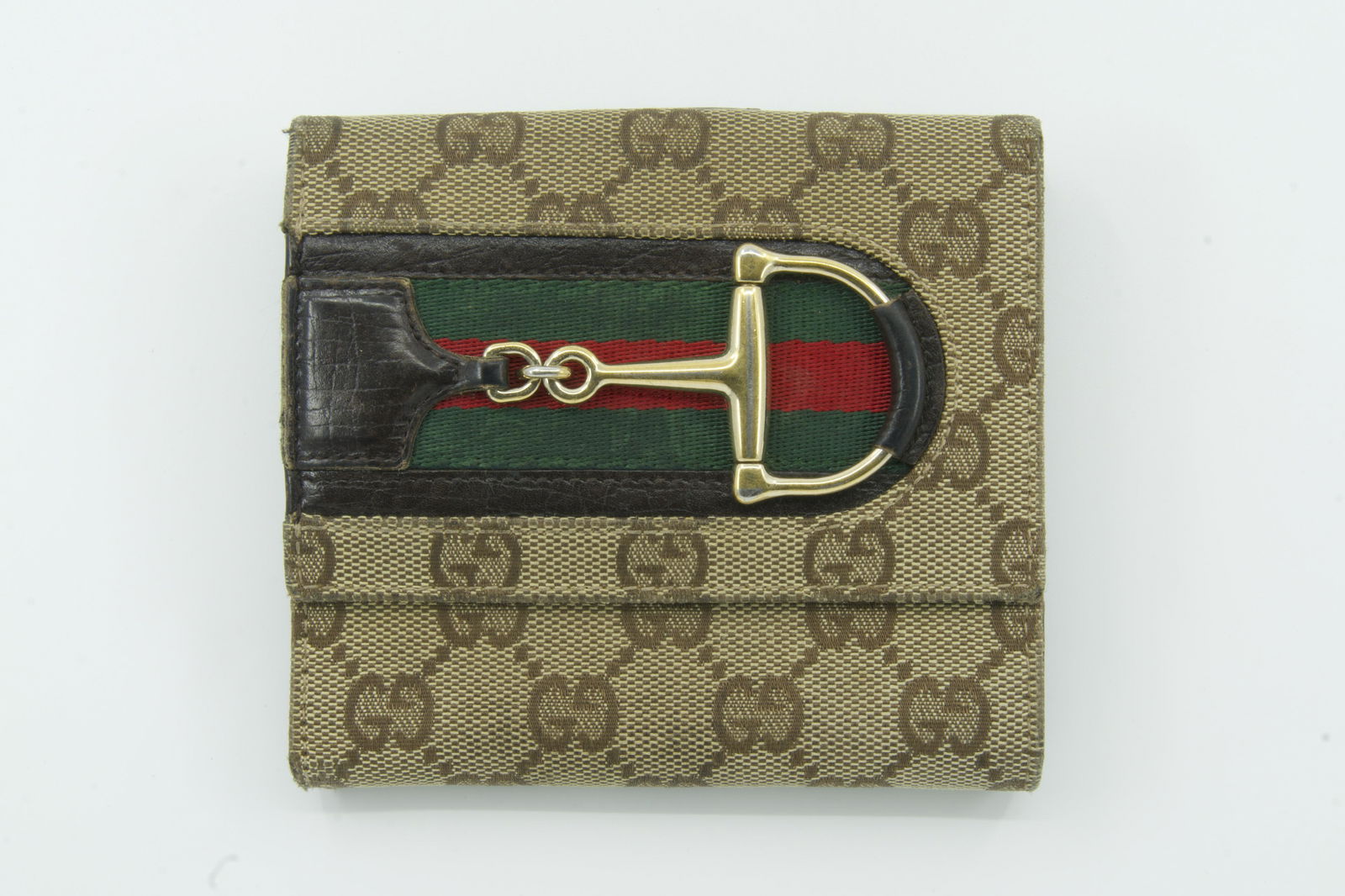 Gucci Horsebit Mongoram Wallet: Slight wear, Discoloraton, Small Rips, and scratches