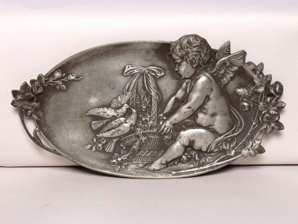 Metalware: Antique Pewter Wall Plaque: Metalware: Antique Pewter Wall Plaque Cherub and Doves. Dimensions: 10.5 inches long