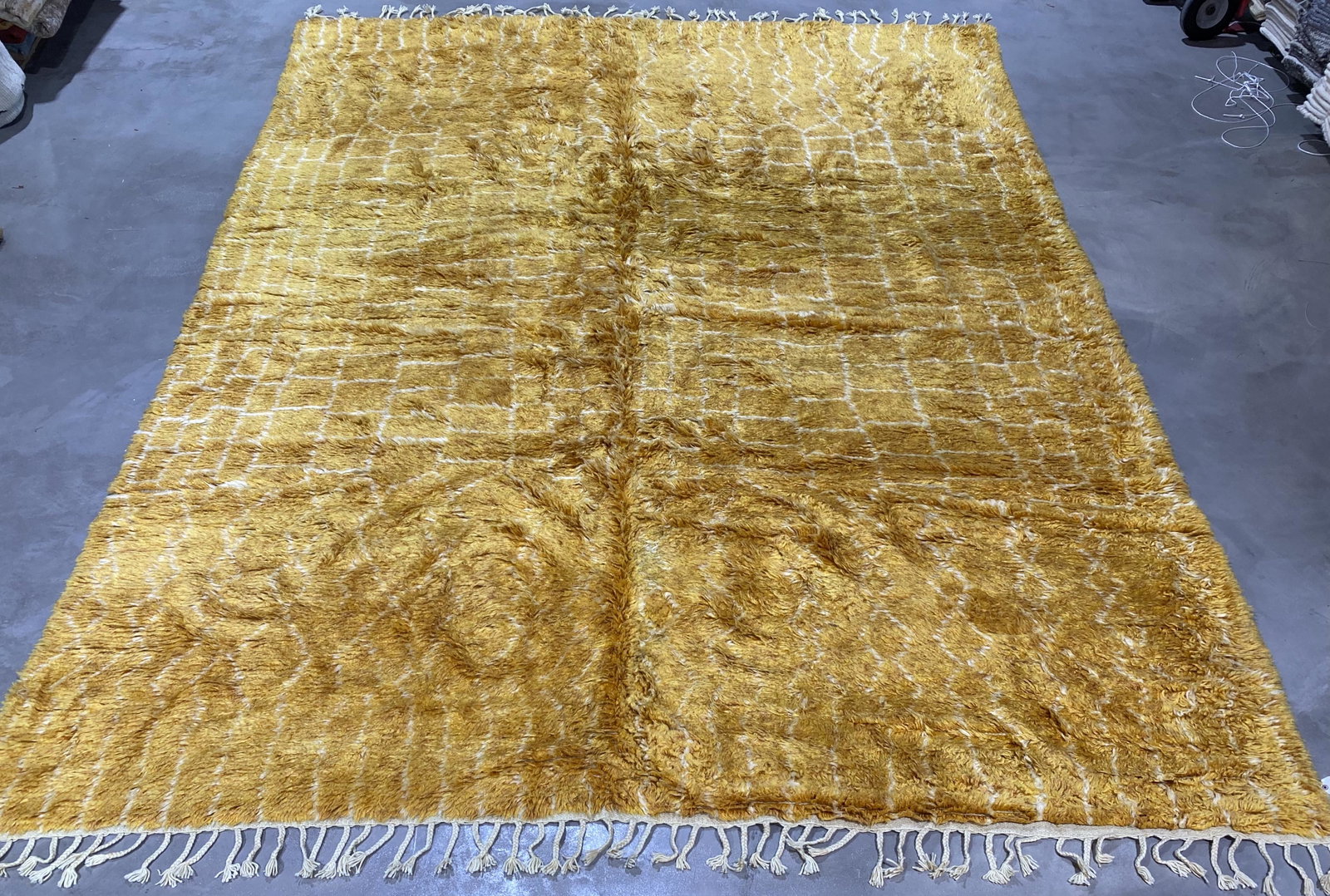 Modern Moroccan Wool 10'4'' x 14'1'' Rug: Hand knotted modern Moroccan golden and ivory colored 10'4'' x 14'1'' wool rug with shaggy pile made in India. Note: All items in this auction are as-is.