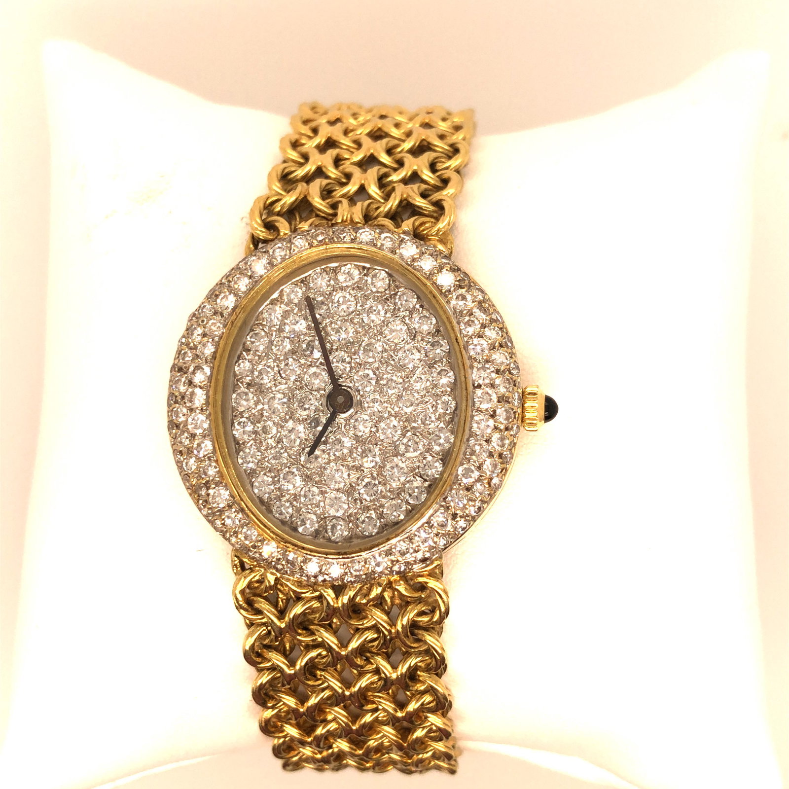 18K Yellow gold Diamonds wrist Watch: Lovely Watch is set with the app. 7 cts of full-cut round diamonds, Diamonds VS in clarity, and G-H in color. Weighs 71gr. Stamped 750 and Piaget. It's 7" long.Movement is Piaget, It is in working con