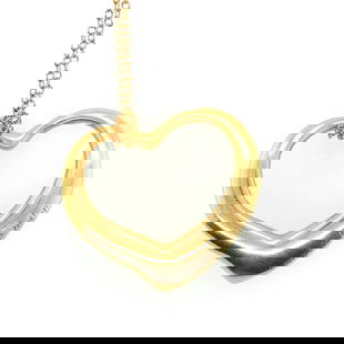 18k Yellow Gold Tiffany heart necklace. With original: Both are signed Tiffany. Weighs 14.8 gr. Heart measures 1x 1 1/4 necklace. Necklace : 30" long. Condition:Excellent.