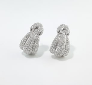 The Damiani Spicchi di Luna earrings are crafted from 18K white gold and feature pavé-set diamonds