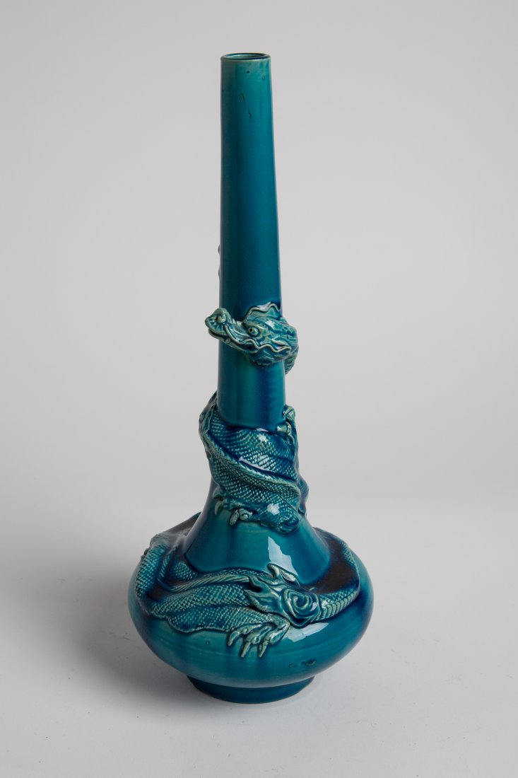 19th Awaji Japanese Blue Dragon Porcelain Vase: Japan, a fine blue-turquoise "writhing dragon" porcelain vase, Awaji Kiln from the late Meiji period (1868-1912).Dimensions: , 14.5 in high ; 5.5 in wide at base, Meiji period, (1868-1912).The heavy p