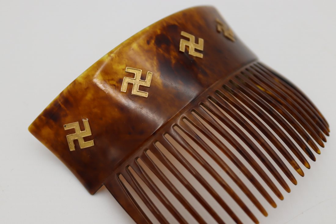 14K Gold Swastikas on Faux Tortoise Shell Hair Comb: Hair Comb/Pin/Peineta 14K Gold Counter-Clockwise Swastikas. It has Hindu/Buddhist symbolism (while the Nazi Swatsika is clockwise). Back of the hair comb has 'Solid Gold' marking.