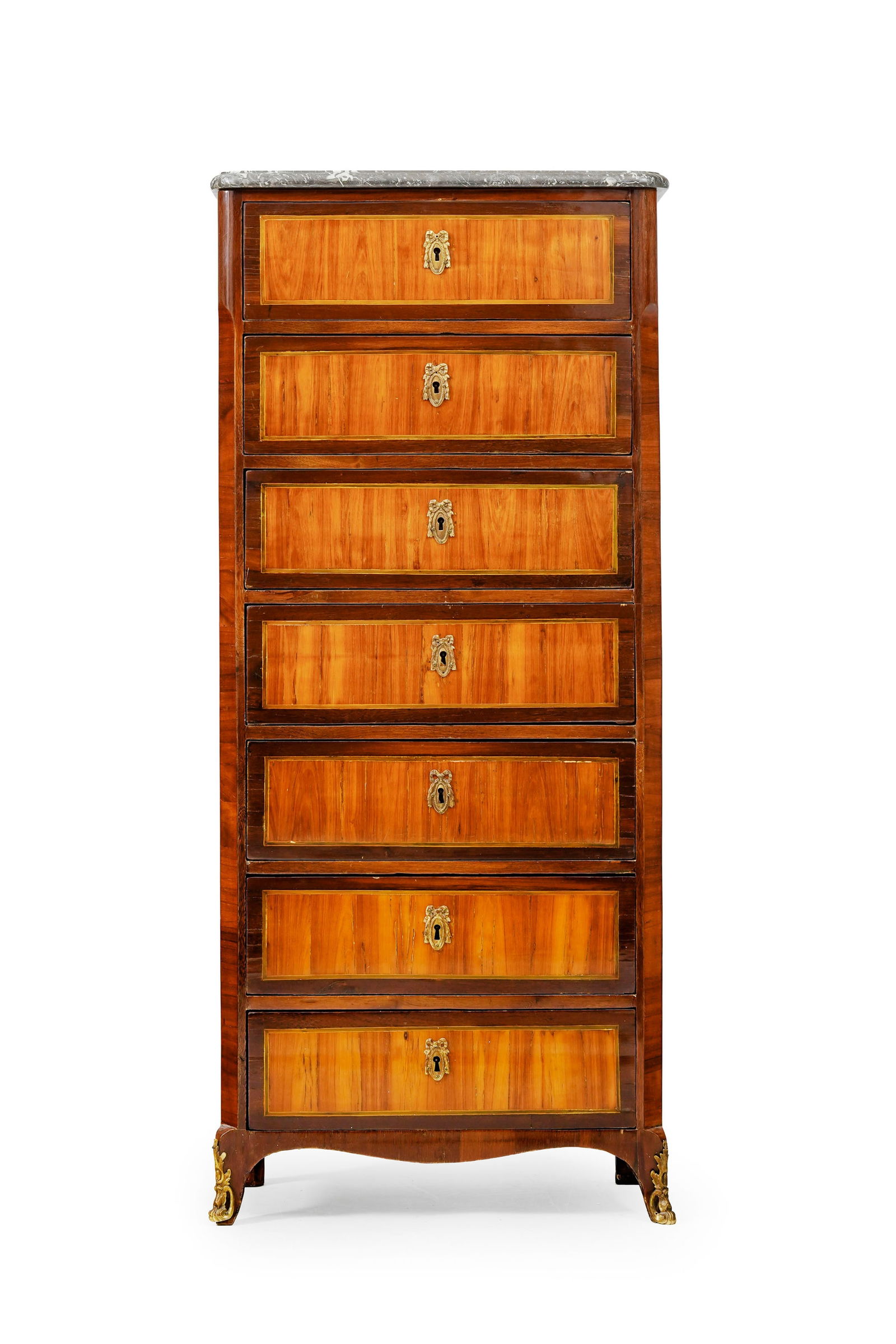 Semainier d'époque Transition, en placage de bois de rose et bois de violette, ouvrant par sept: Semainier d'époque Transition, en placage de bois de rose et bois de violette, ouvrant par sept tiroirs en façade, plateau en marbre gris, pieds cambrés, porte une estampille