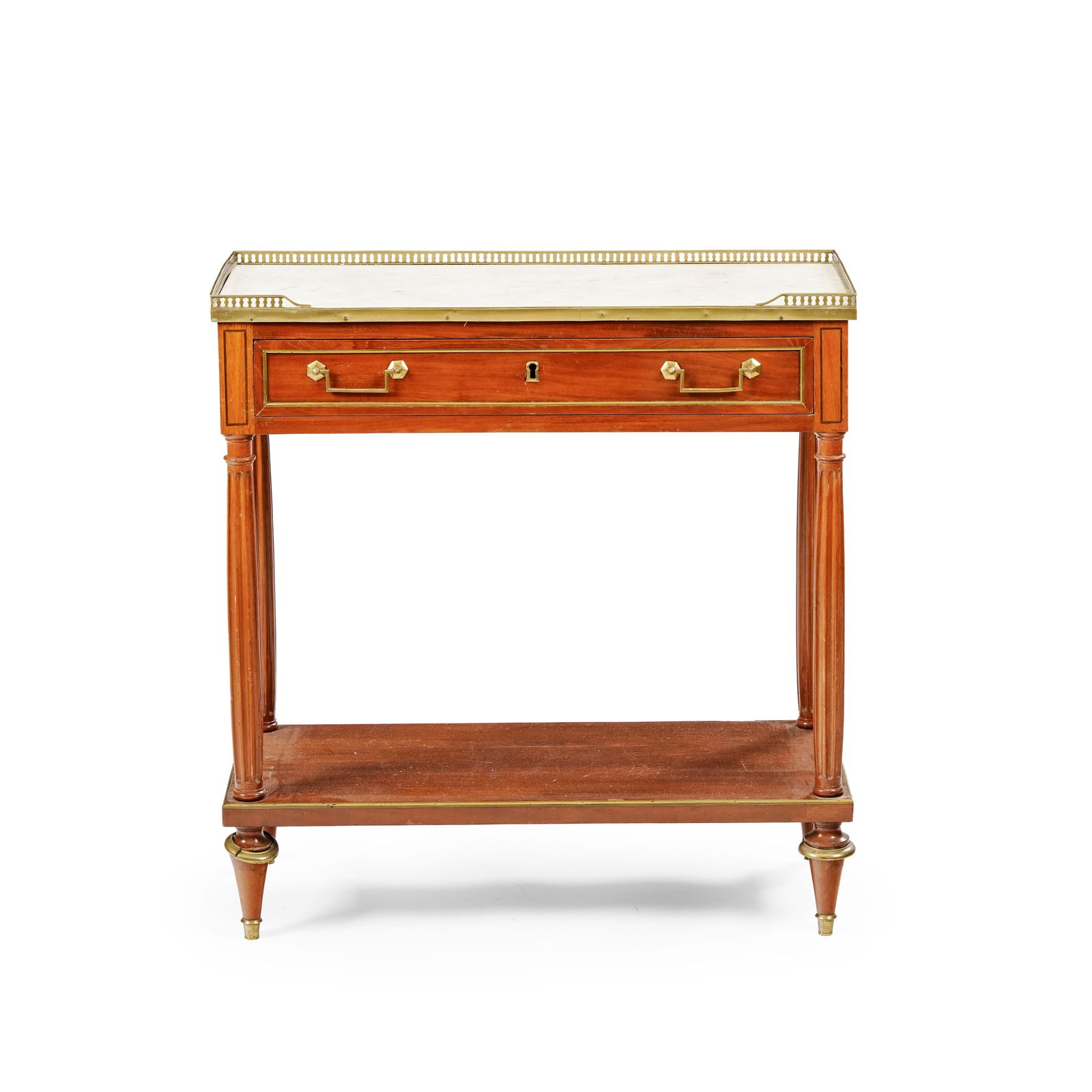 Desserte d'époque Louis XVI, en acajou, placage d'acajou et filets de marqueterie, ouvrant par : Desserte d'époque Louis XVI, en acajou, placage d'acajou et filets de marqueterie, ouvrant par un tiroir en ceinture, plateau en marbre blanc ceint d'une galerie ajourée, montants cannel