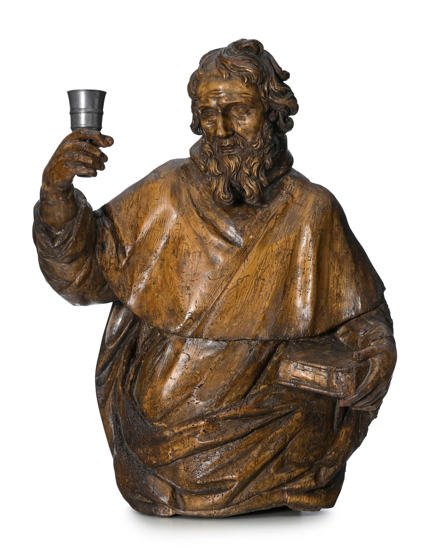 Saint Paul, buste mi-corps finement sculpté en bois, probablement France XVIIe s., vêtu d&: Saint Paul, buste mi-corps finement sculpté en bois, probablement France XVIIe s., vêtu d’une aube recouverte d’un manteau surmonté de la mozzette, il tient les
