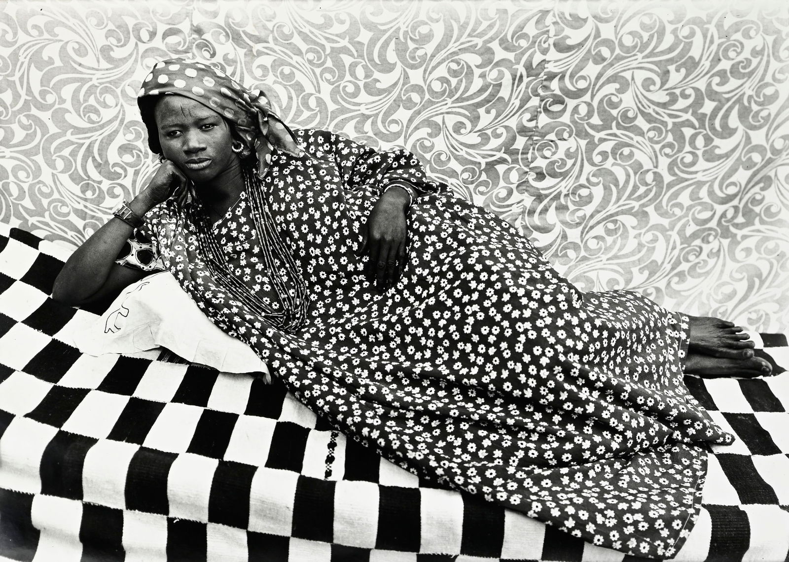 Seydou Keita (1921-2001), Sans titre (L'odalisque, 1956-57), 9.12.1996, tirage argentique, signé: Seydou Keita (1921-2001), Sans titre (L'odalisque, 1956-57), 9.12.1996, tirage argentique, signé et daté, 124x182 cm (feuille, à vue) Provenance: Galerie Magnin-A, Paris; Collection