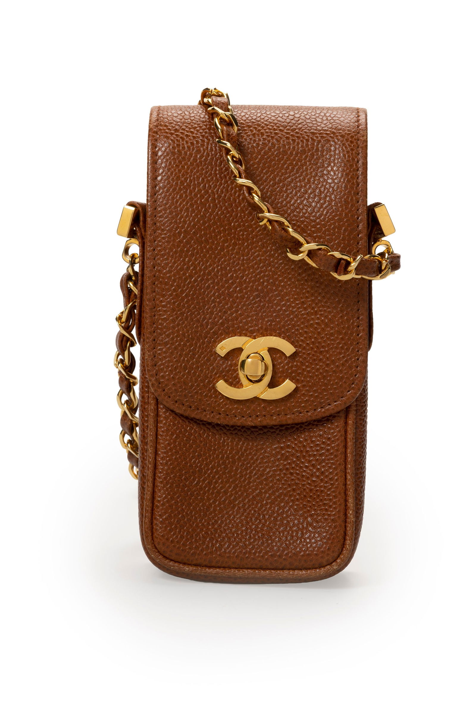 Chanel, pochette verticale en cuir caviar cannelle, années 1994-1996, longue bandoulière &: Chanel, pochette verticale en cuir caviar cannelle, années 1994-1996, longue bandoulière à chaînette en métal doré et cuir entrelacé, carte d'authenticité,