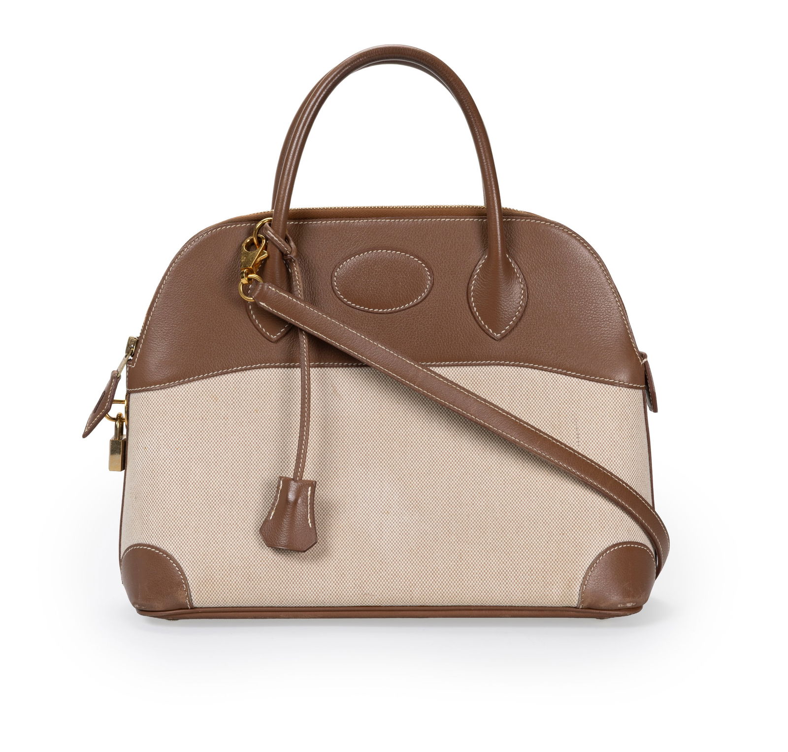 Hermès, sac Bolide 31 en toile H beige et cuir Gulliver Mocca, année 1998, tirette et cloc: Hermès, sac Bolide 31 en toile H beige et cuir Gulliver Mocca, année 1998, tirette et clochettes avec 2 clefs et cadenas, bandoulière, housse, 24x31 cm ConditionMoyen état de