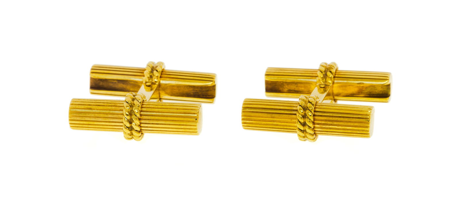 Cartier, paire de boutons de manchette or 750 avec deux paires de bâtonnets interchangeables en: Cartier, paire de boutons de manchette or 750 avec deux paires de bâtonnets interchangeables en or 750 cannelé, signés, numérotés 014024, h. 2 cm, 10g ConditionBon état