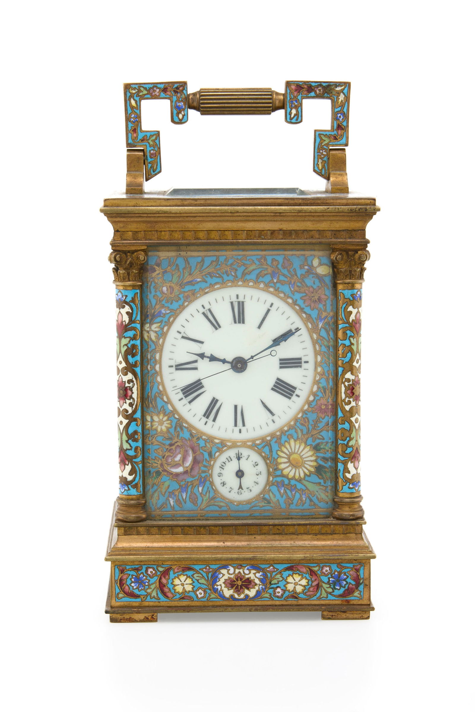 Pendulette d'officier à répétition en laiton et émail polychrome à motif fl: Pendulette d'officier à répétition en laiton et émail polychrome à motif floral Mouvement: mécanique Boîtier: dim. 15.8 x 10 cm Complication: répétition 