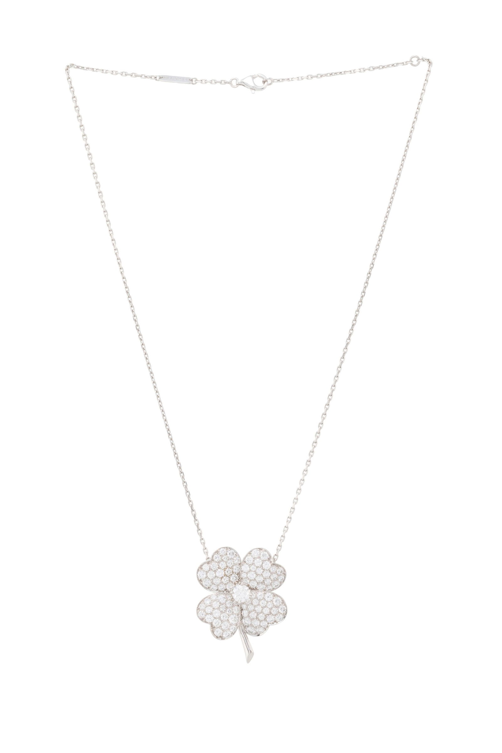Van Cleef & Arpels, Cosmos, broche-pendentif or gris 750 pavée de diamants taille brillant dont: Van Cleef & Arpels, Cosmos, broche-pendentif or gris 750 pavée de diamants taille brillant dont un plus important au centre, sur sa chaîne VCA en or gris 750 à maille forçat