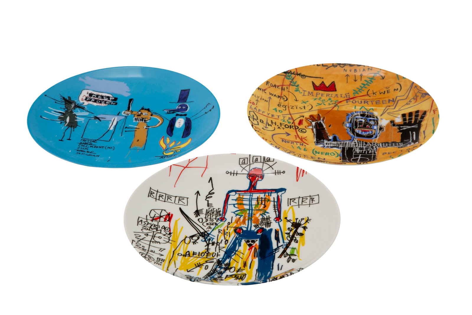 Suite de 3 assiettes en porcelaine de Limoges, Ligne Blanche éditeur, à décor d'apr&#: Suite de 3 assiettes en porcelaine de Limoges, Ligne Blanche éditeur, à décor d'après Jean-Michel Basquiat: Untitled, All Colored Cast I et The dingoes that park brain with their