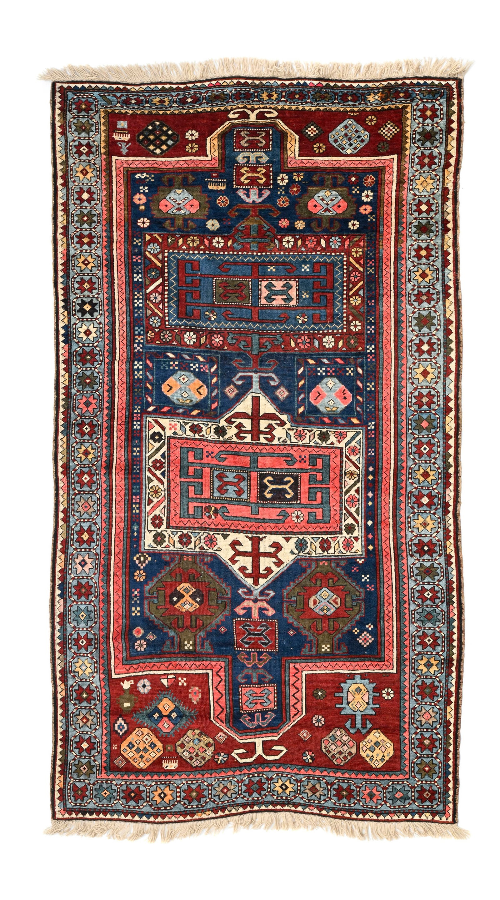Tapis Kazakh, Caucase, 1er tiers du XXe s., à décor de motifs géométriques polyc: Tapis Kazakh, Caucase, 1er tiers du XXe s., à décor de motifs géométriques polychrome inscrits dans un double mihrab bleu, bordure ornée d'une frise d'étoiles, 136x234