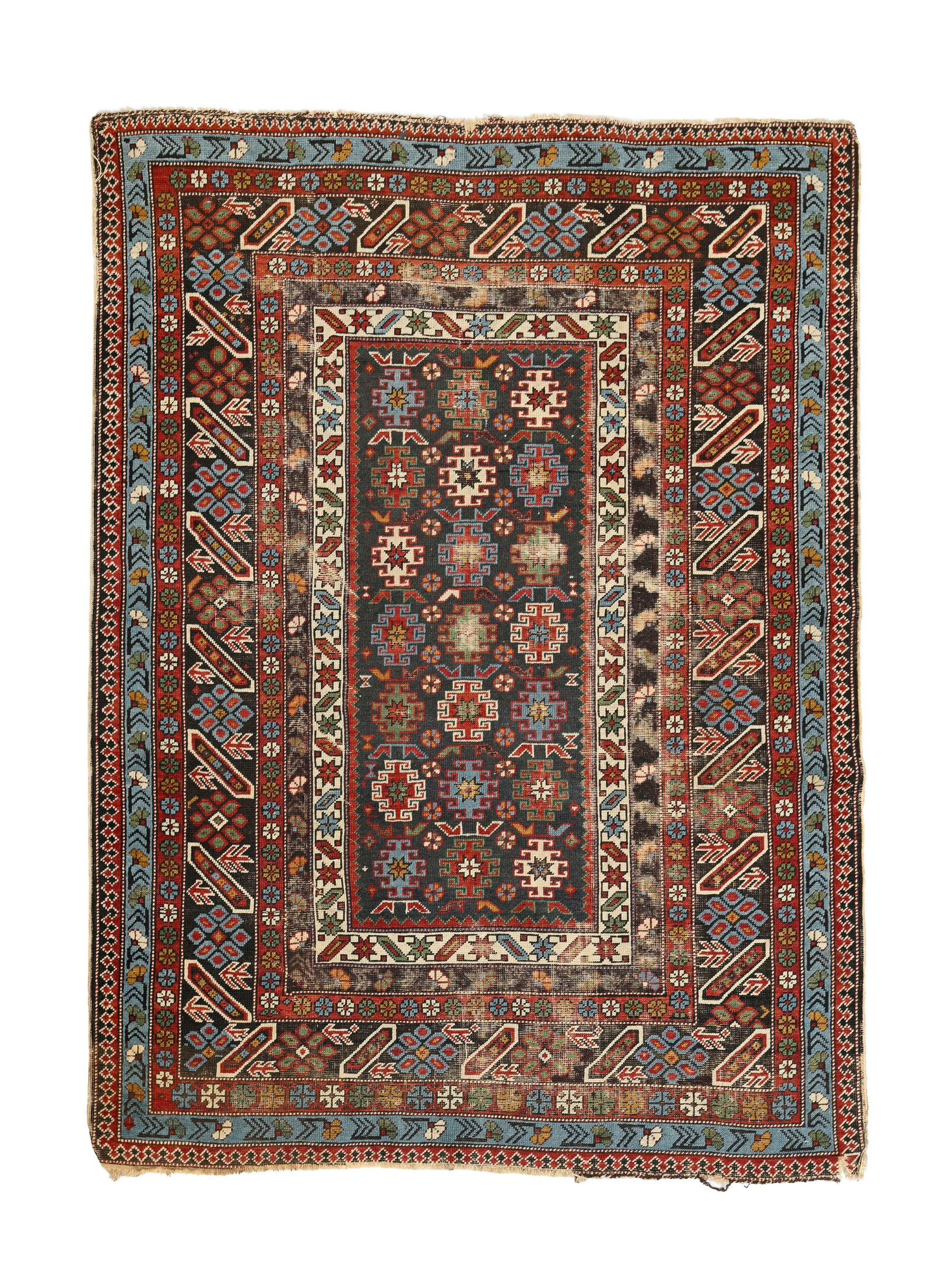 Tapis Shirvan, Caucase, 1er tiers du XXe s., à semis de petits médaillons polychromes styl: Tapis Shirvan, Caucase, 1er tiers du XXe s., à semis de petits médaillons polychromes stylisés sur fond noir, multiples bordures à frises de motifs géométriques, 111x147 
