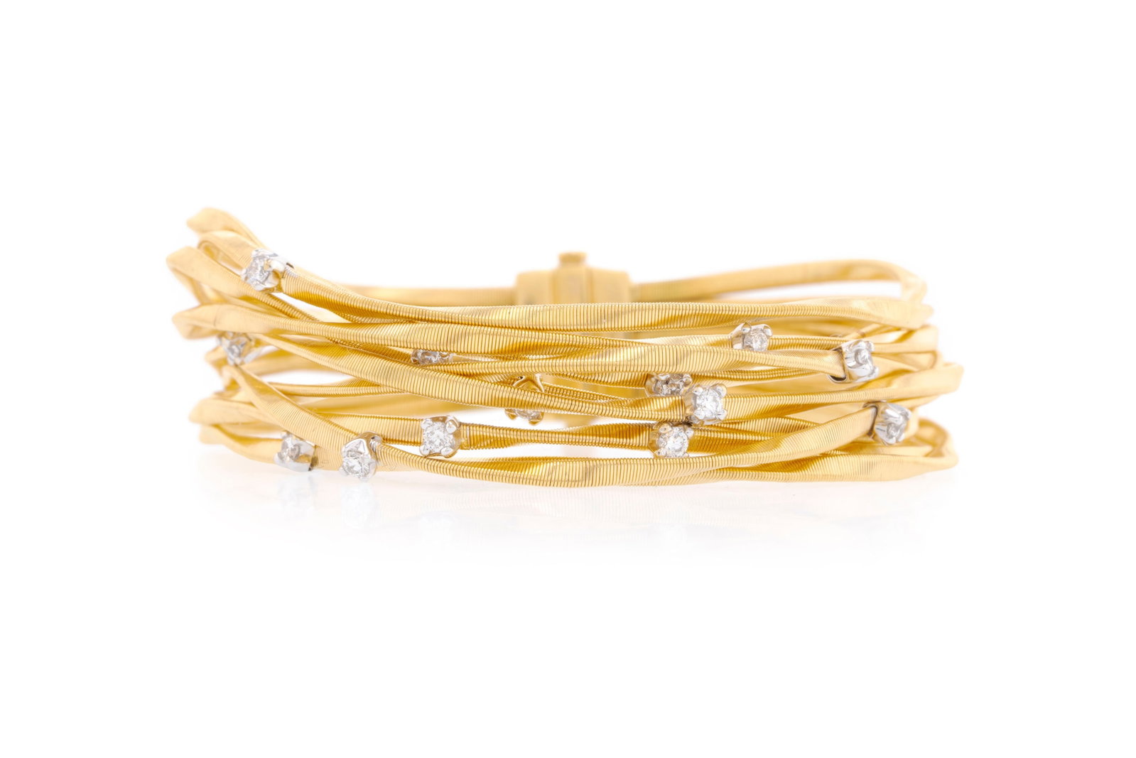 Marco Bicego, bracelet or 750 composé de plusieurs bandes flexibles surmontées de diamants: Marco Bicego, bracelet or 750 composé de plusieurs bandes flexibles surmontées de diamants taille brillant, signé, long. 19 cm, 50g, pochette Condition Bon état de conservation