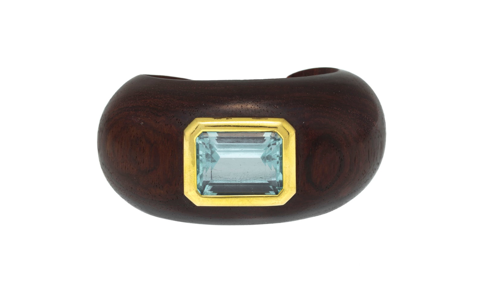 Liliane Sicard, bracelet manchette en bois et or 750 serti d'une aigue-marine rectangulaire à p: Liliane Sicard, bracelet manchette en bois et or 750 serti d'une aigue-marine rectangulaire à pans coupés, signé, circ. 15 cm Condition Bon état de conservation général.